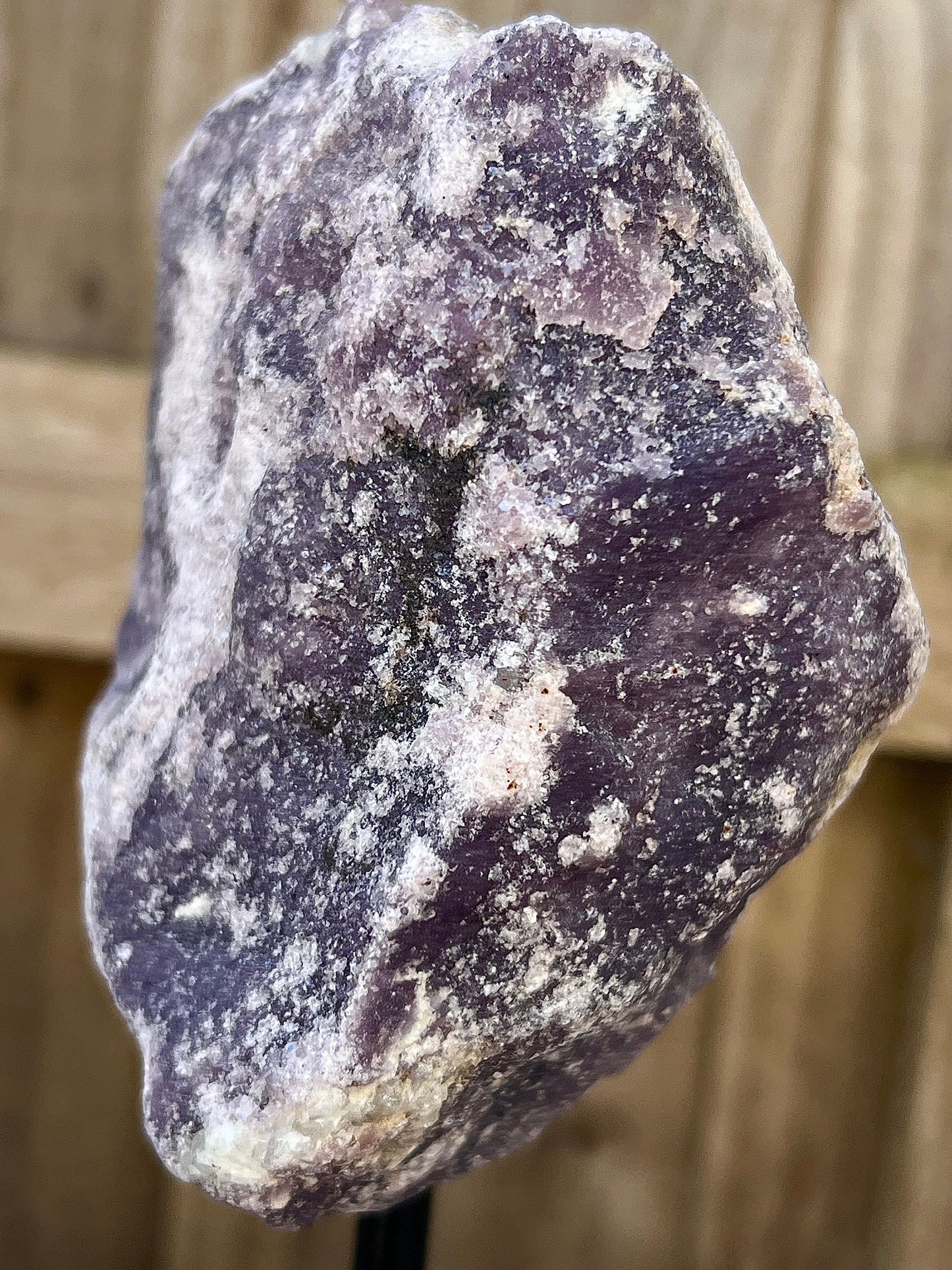 Rough lepidolite on stand