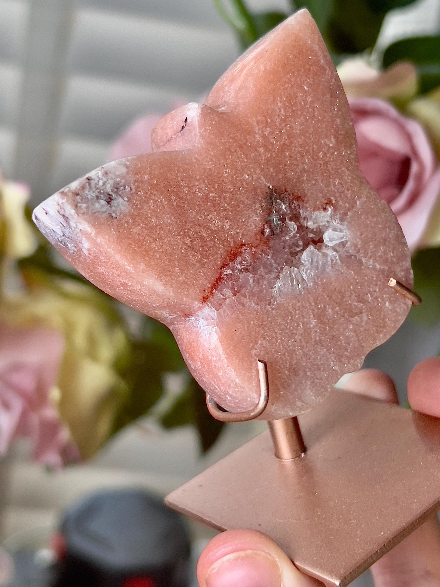 Pink amethyst butterfly in a peach tone with quartz middle and rutile edging, comes with stand