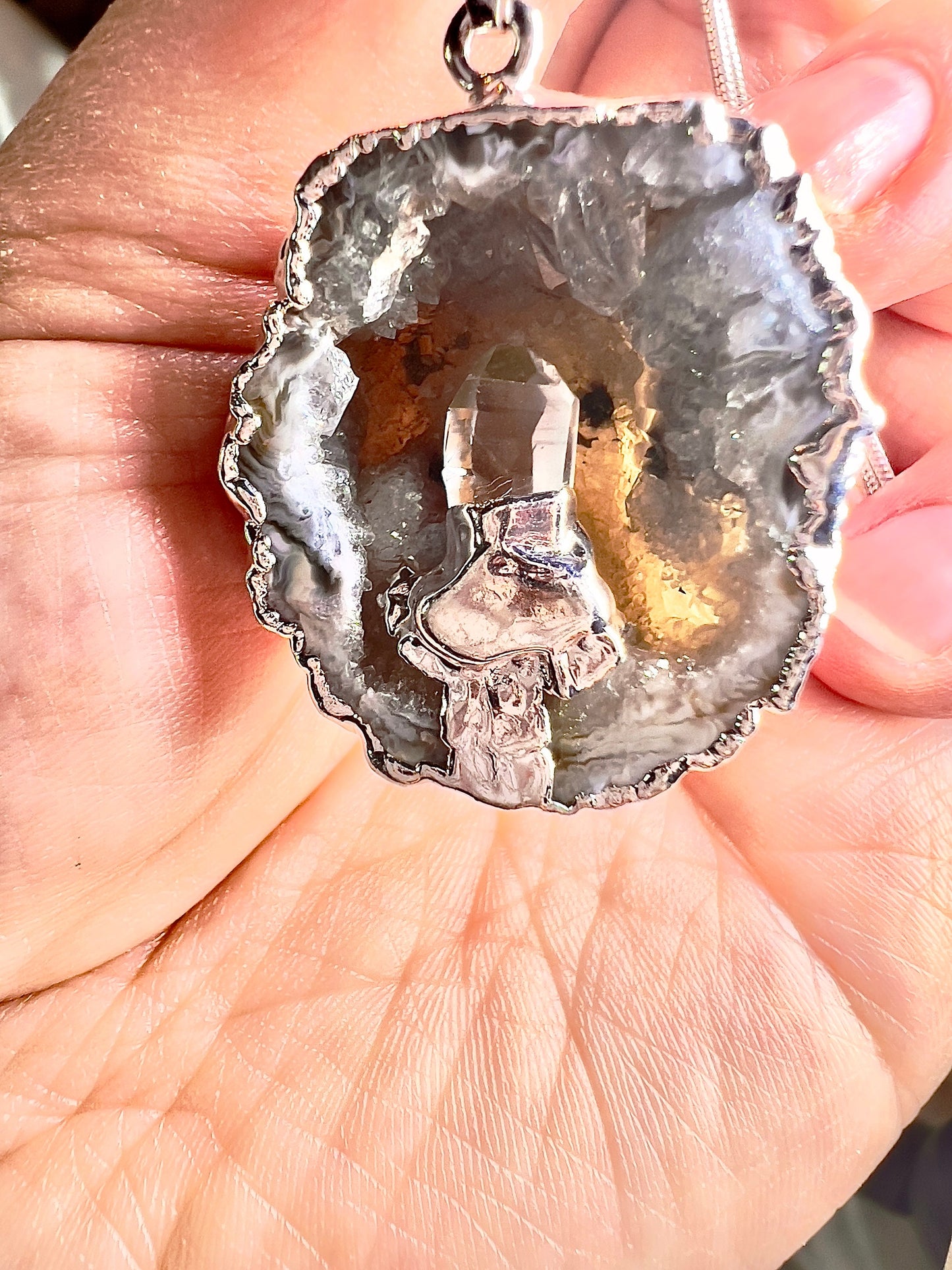 Silver plated druzy agate geode with clear quartz point
