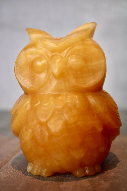 Large, orange calcite, owl carving 10cm(h) 8cm(w)