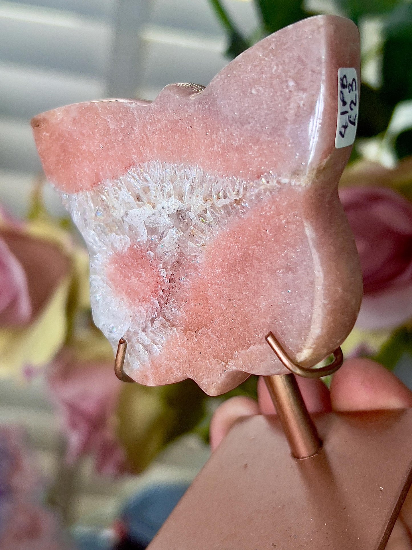 Pink amethyst butterfly in a peach tone with flower on stand