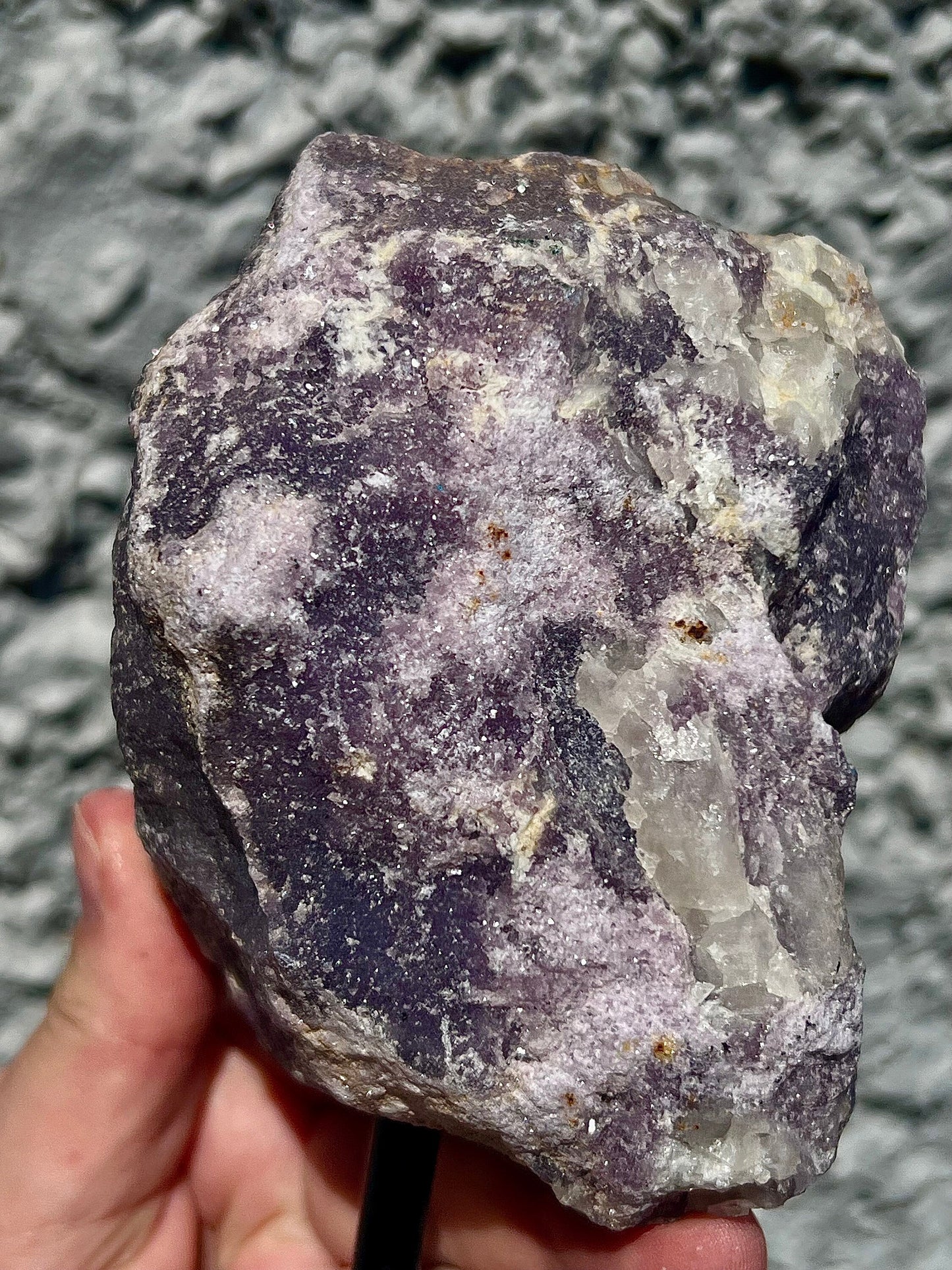 Rough lepidolite on stand