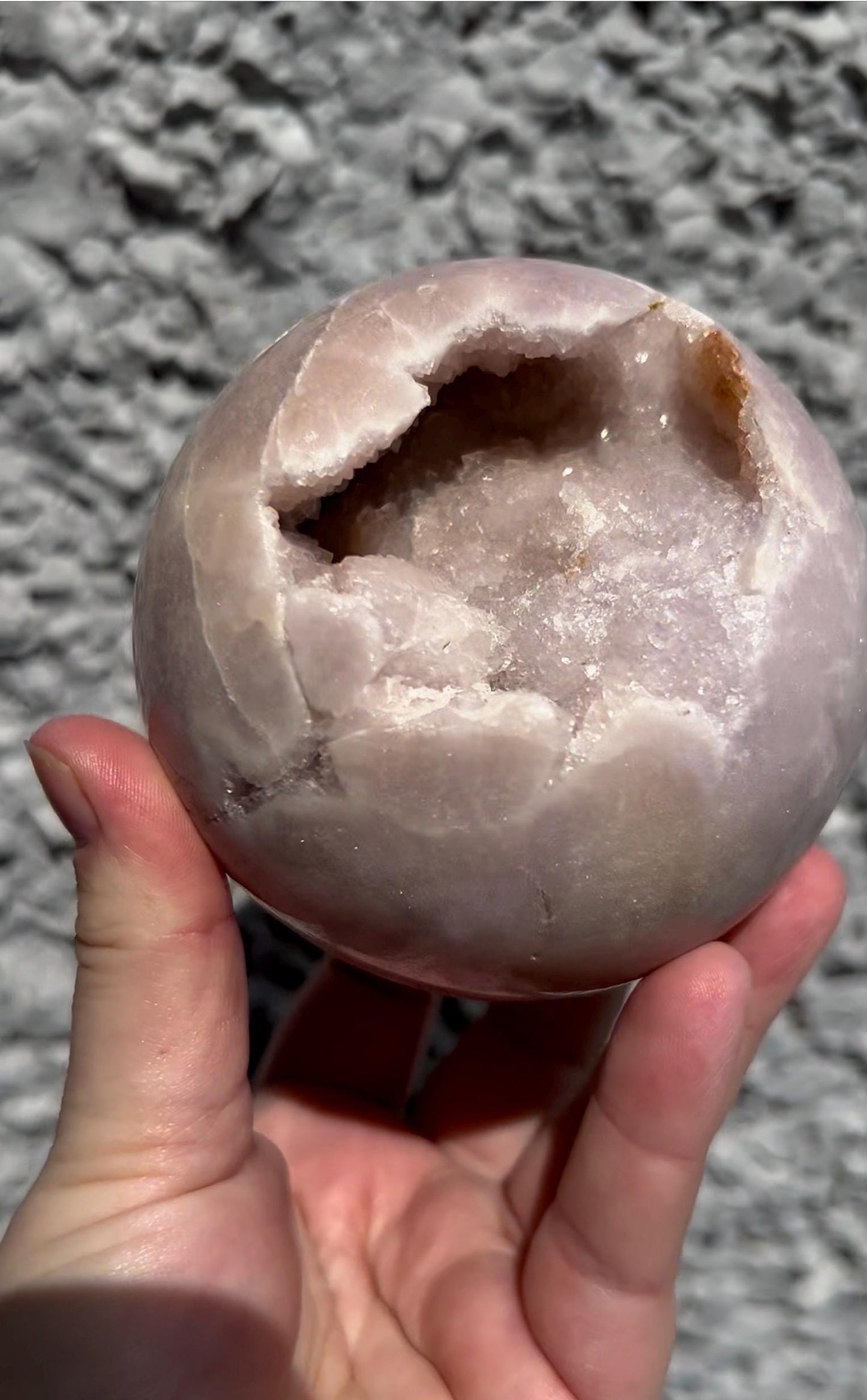 large, perfect baby pink amethyst sphere with sugar druzy cave and jasper 895g