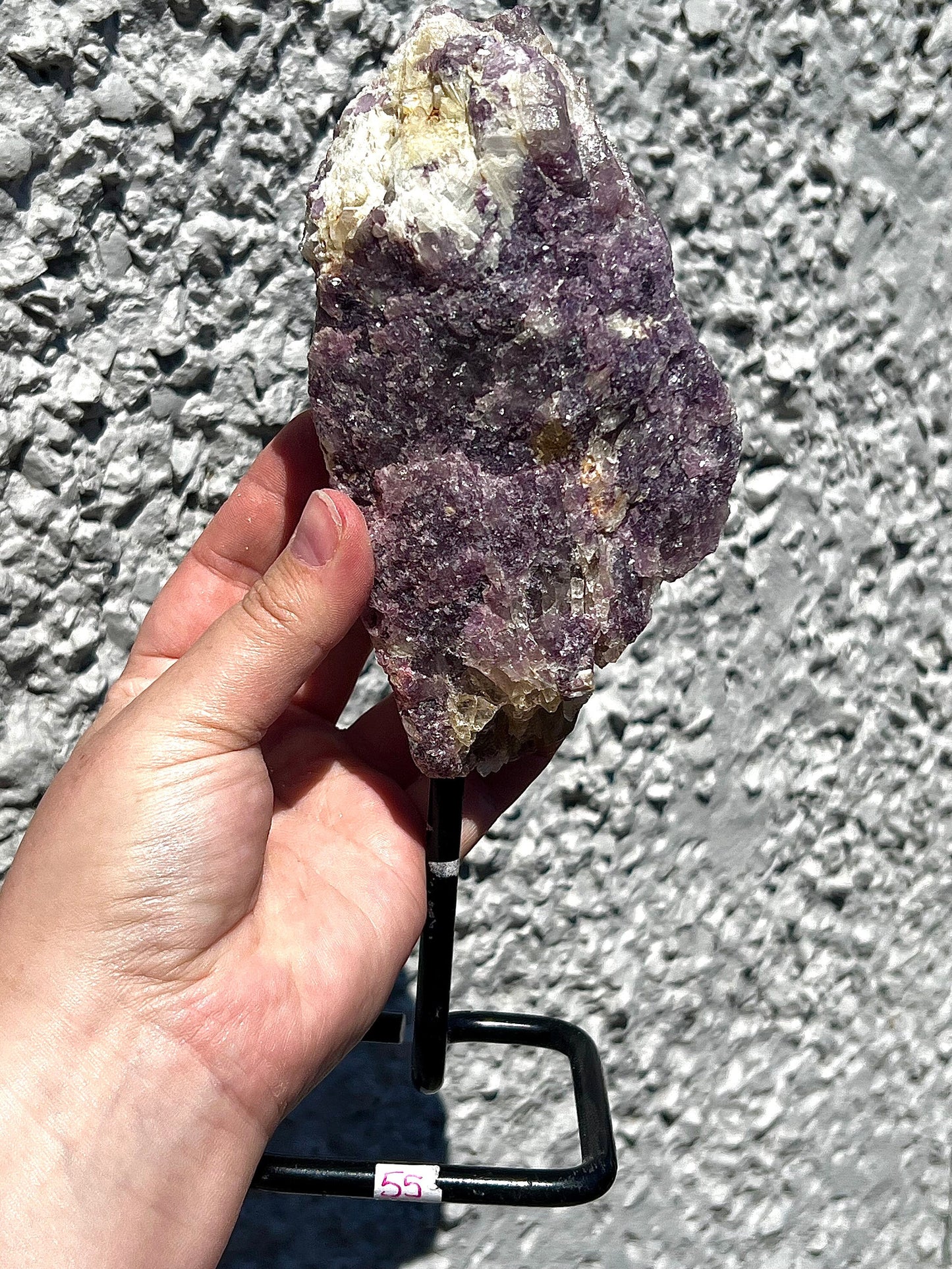 Rough lepidolite on stand