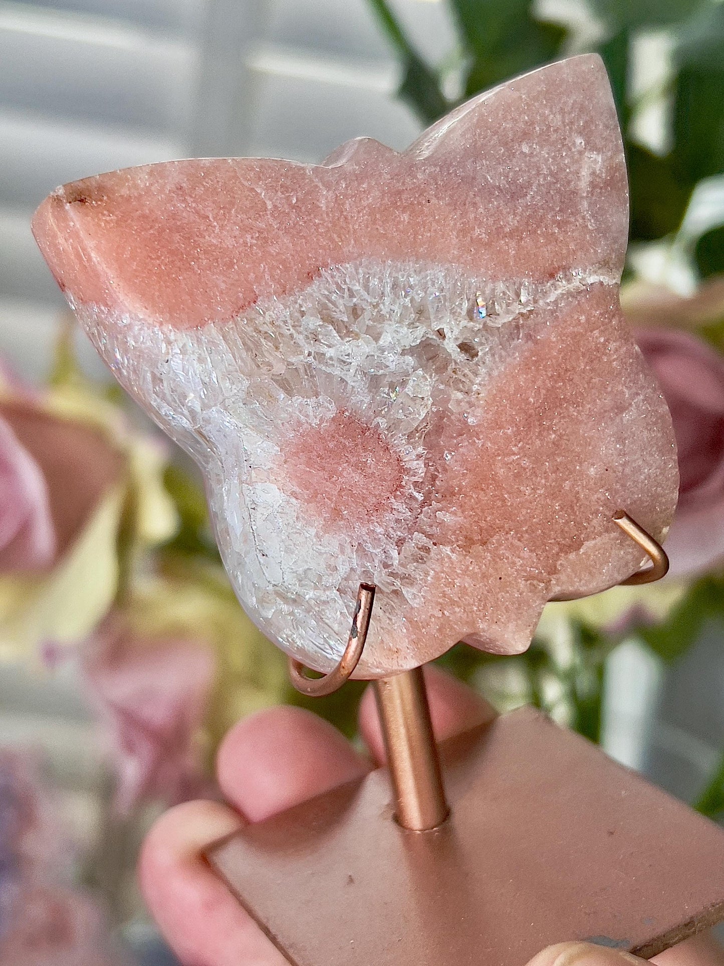Pink amethyst butterfly in a peach tone with flower on stand