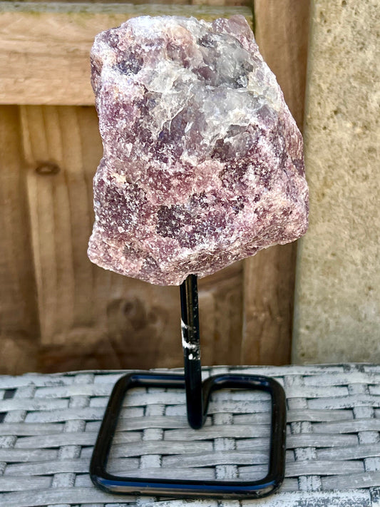 Rough lepidolite on stand