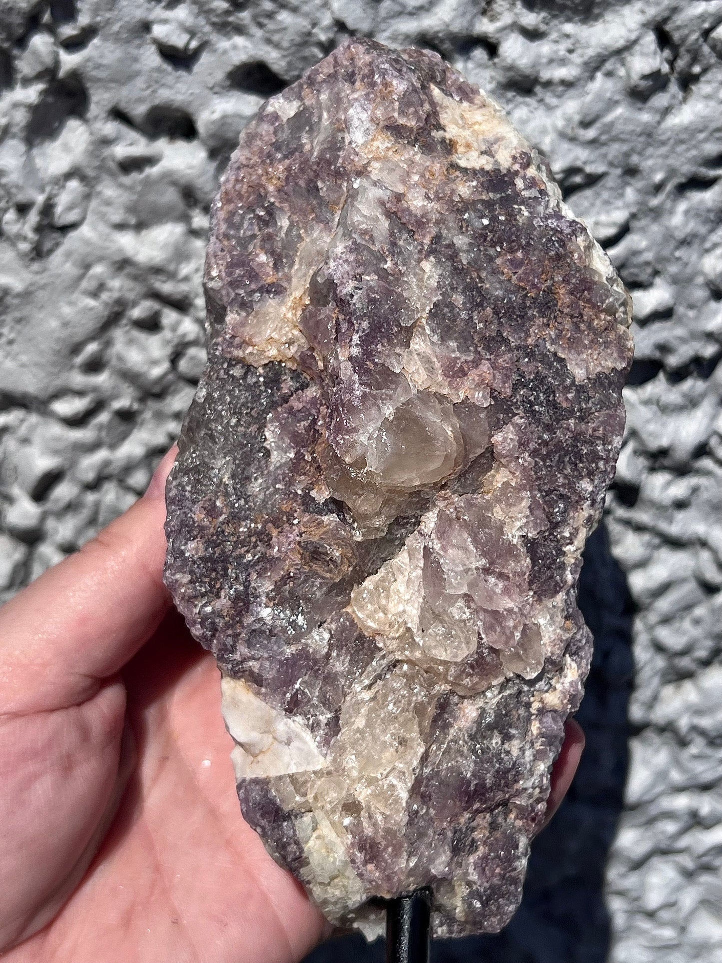 Rough lepidolite on stand