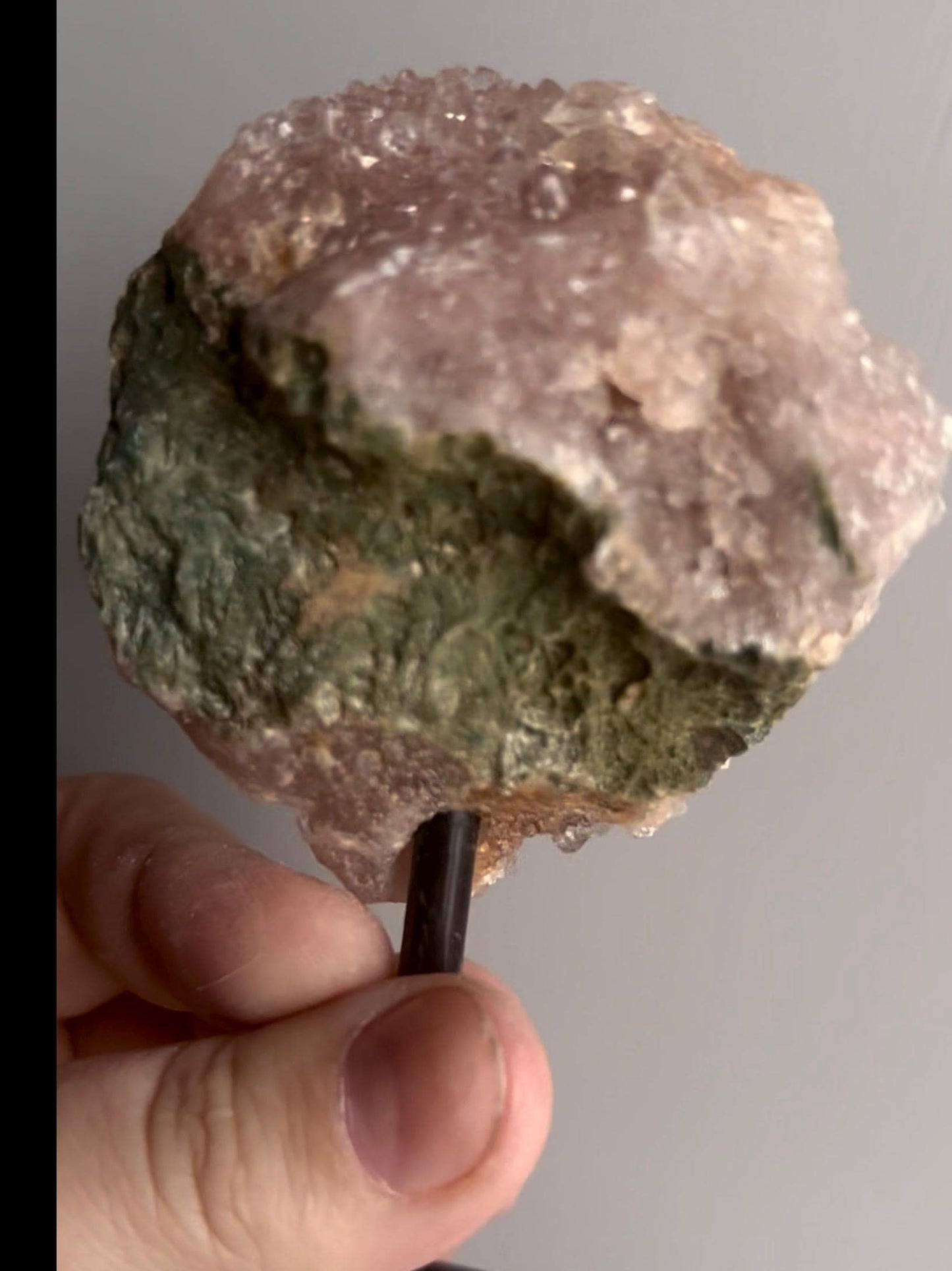 Pink amethyst geode on stand