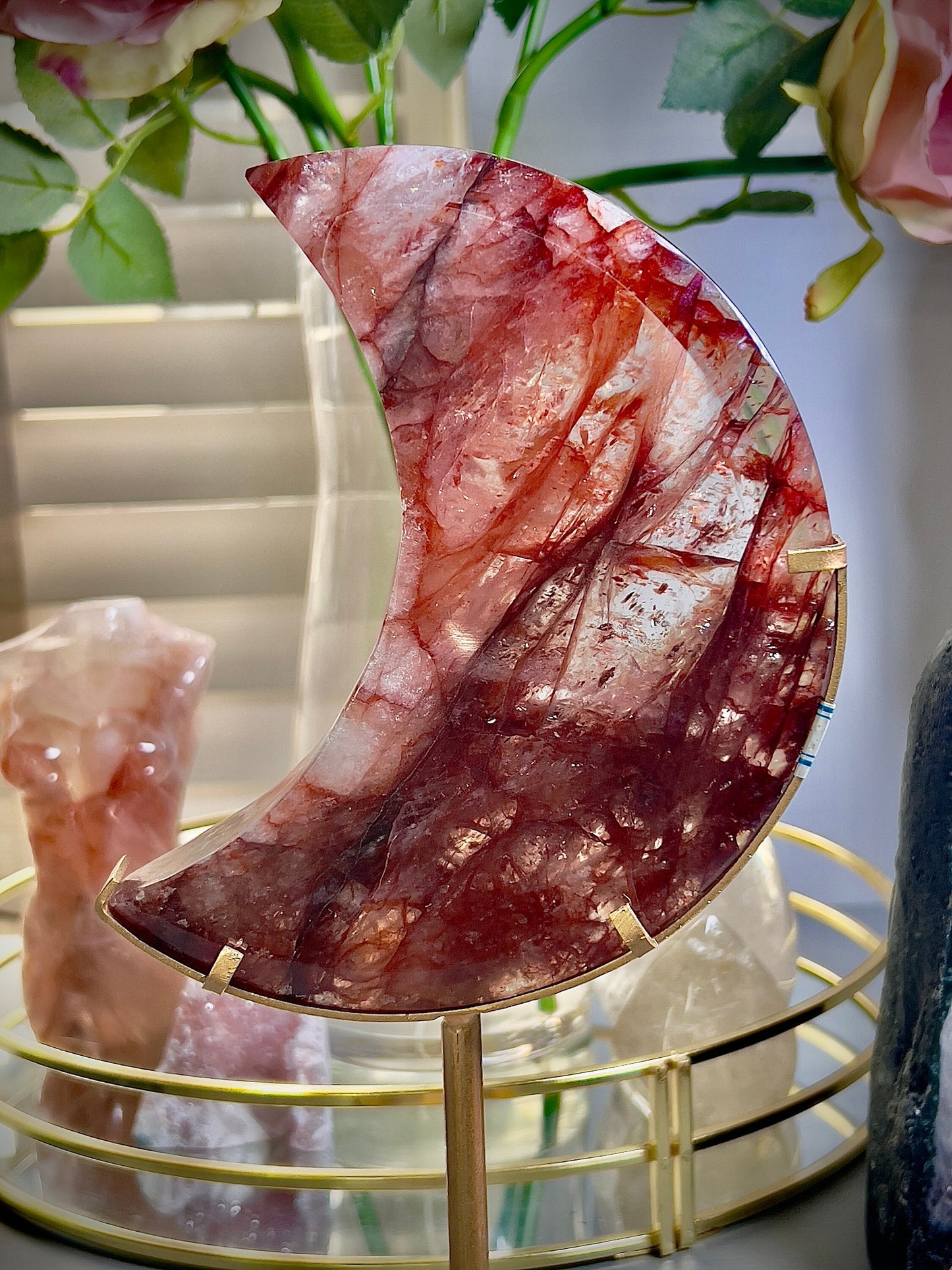 large, high grade, red fire quartz moon on stand