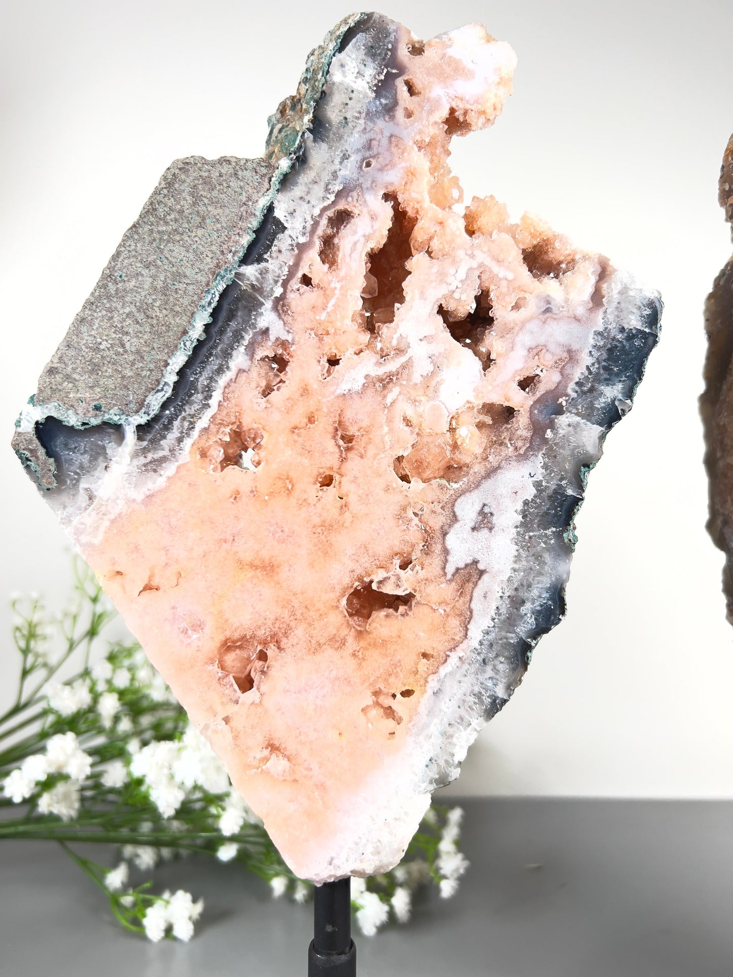 Gorgeous, peach, pink amethyst with smoky crystallisation and natural stone edging slab on turntable stand