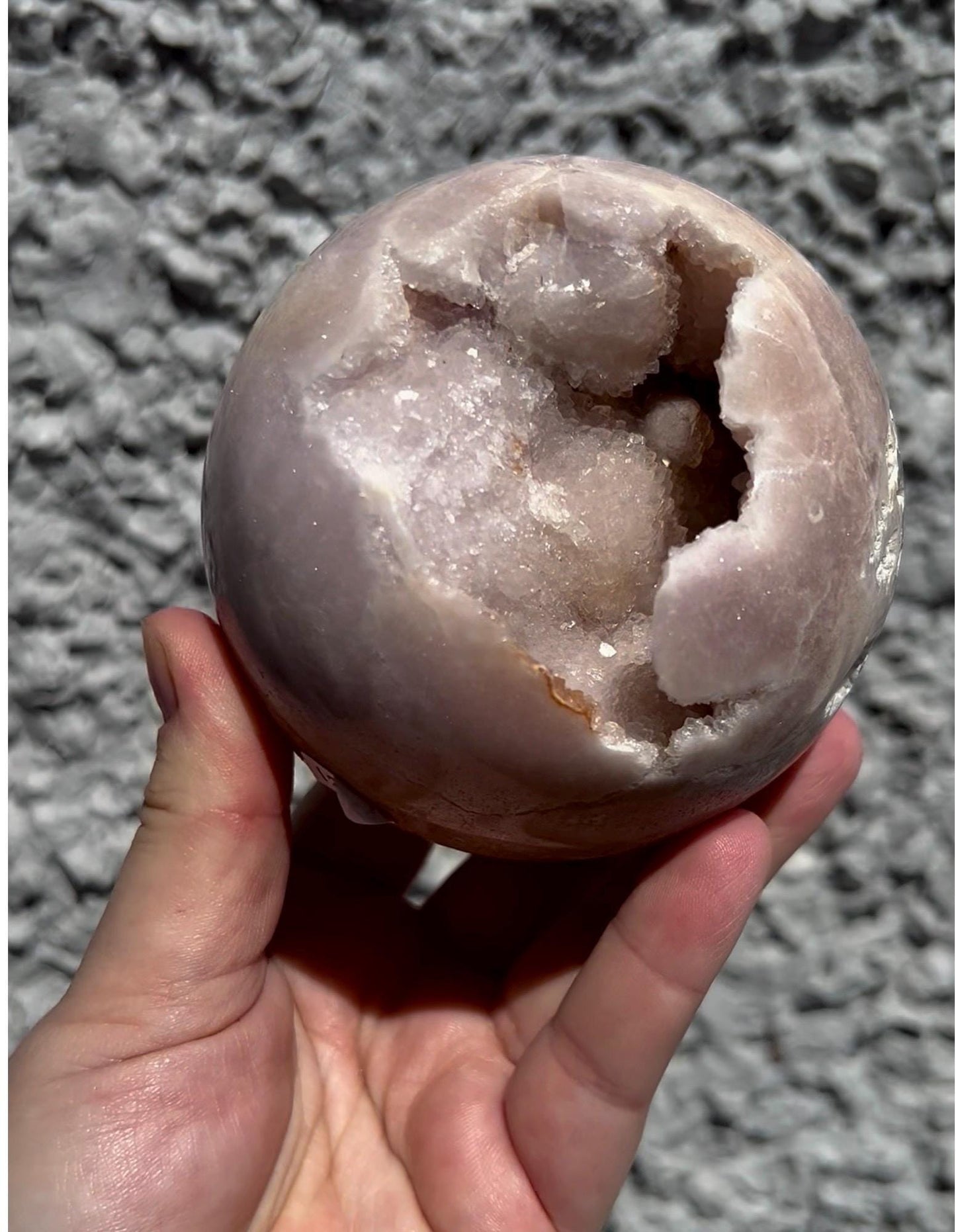 large, perfect baby pink amethyst sphere with sugar druzy cave and jasper 895g