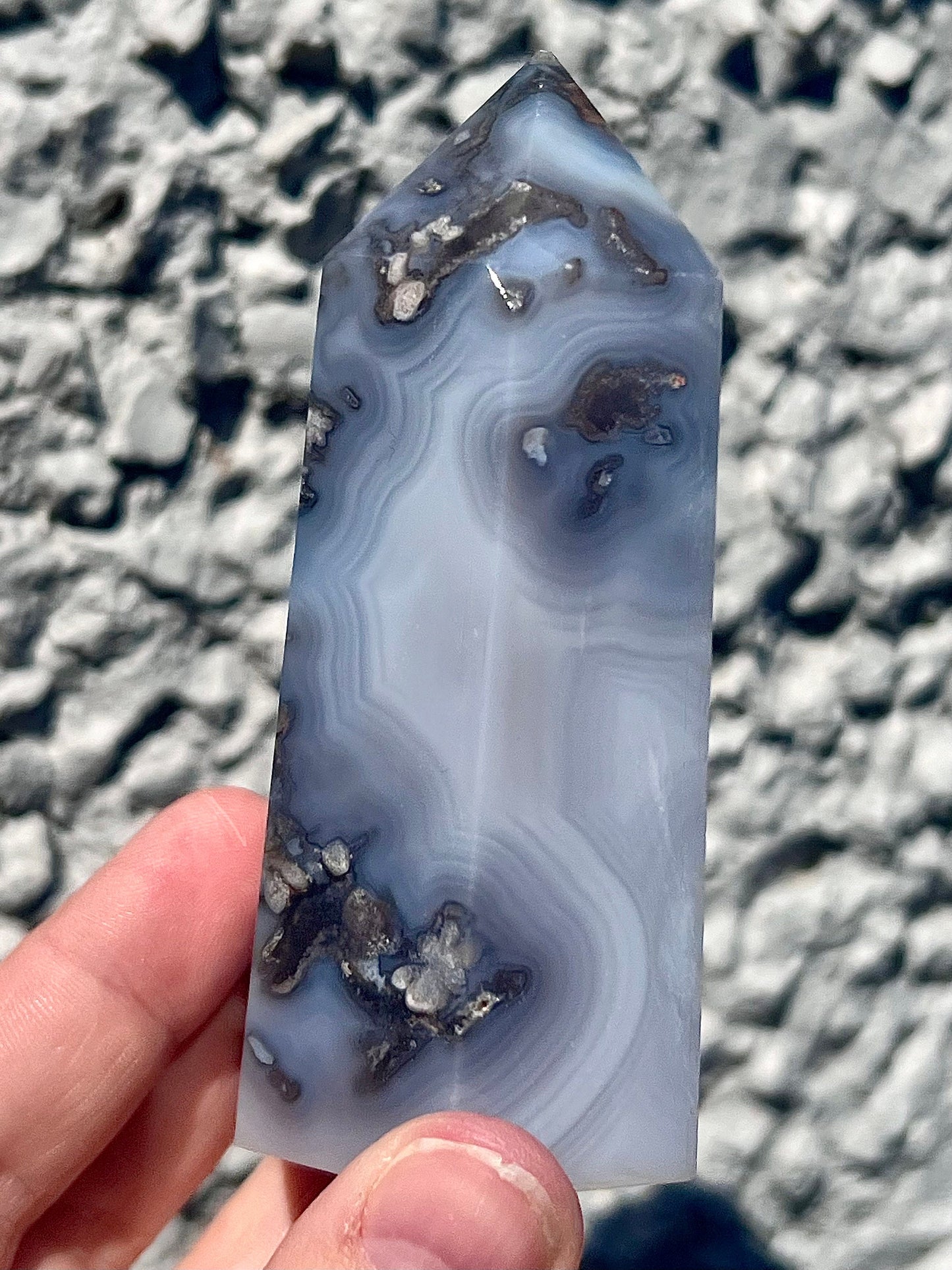 Black/grey/blue flower agate tower with banding and quartz 254g 11cm