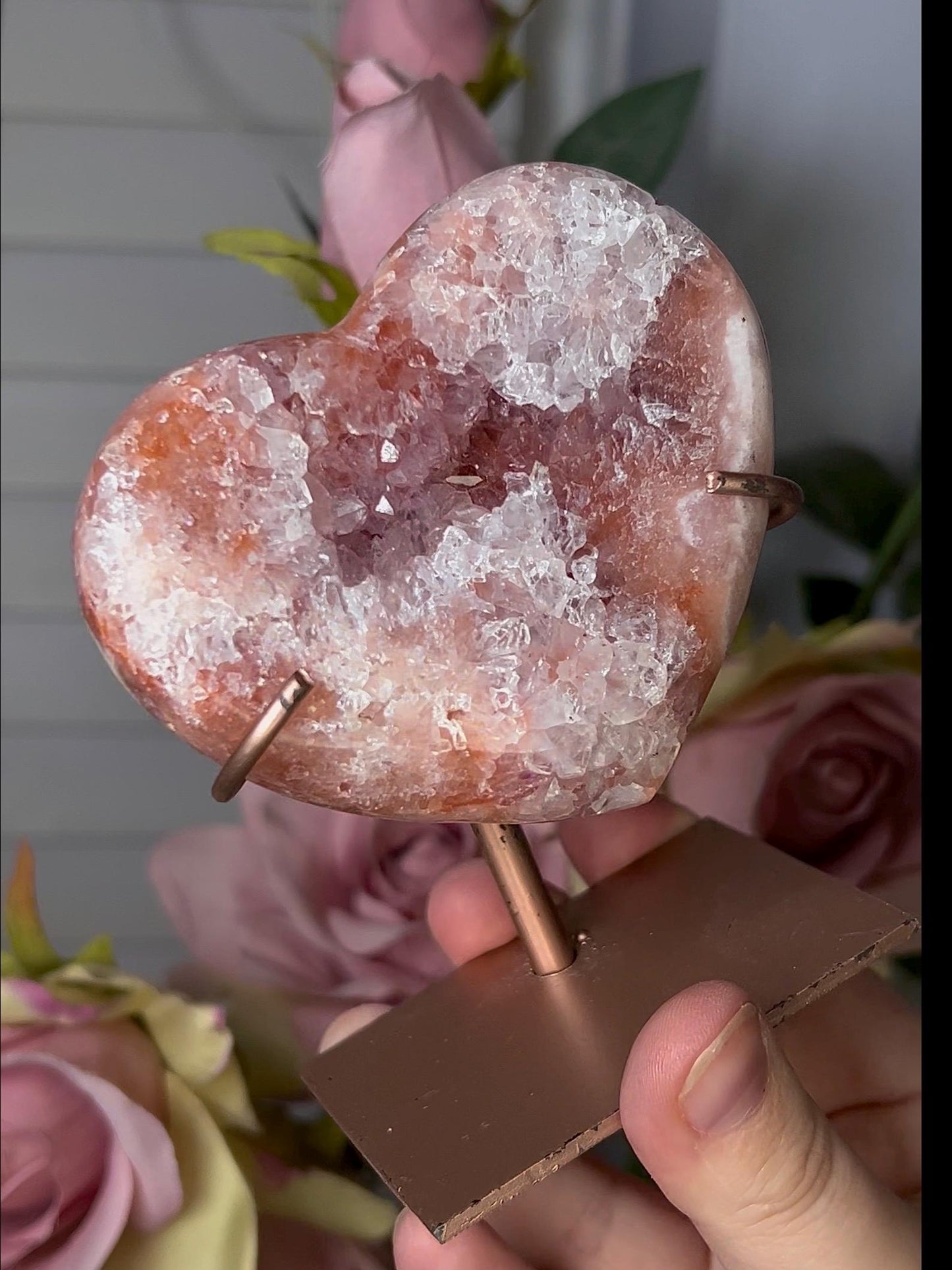Beautiful, pink amethyst heart with vibrant red tone quartz, on stand