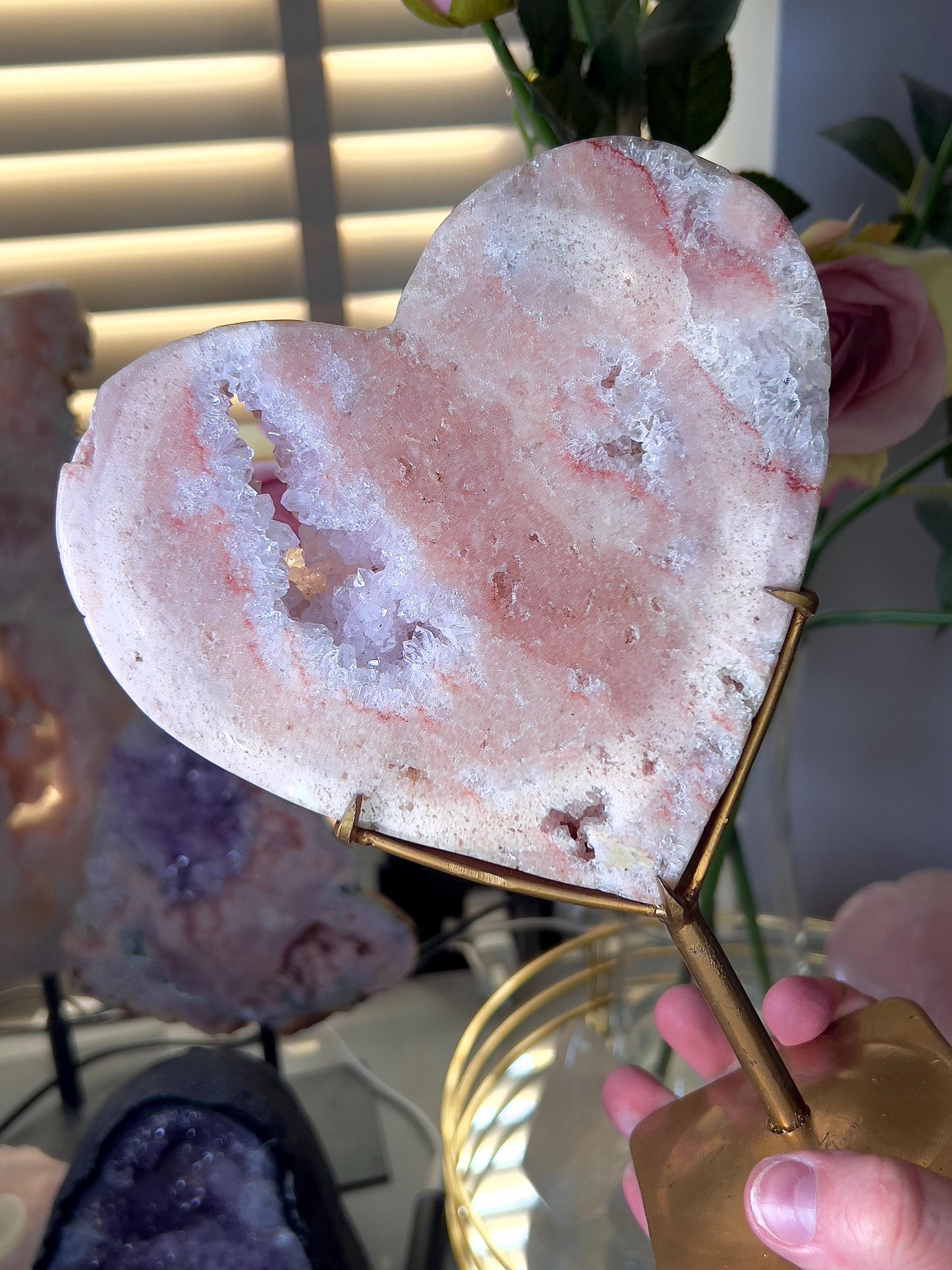 High quality, peach toned, pink amethyst heart with high drape quartz & red hematite lining on a custom gold stand 1.274kg