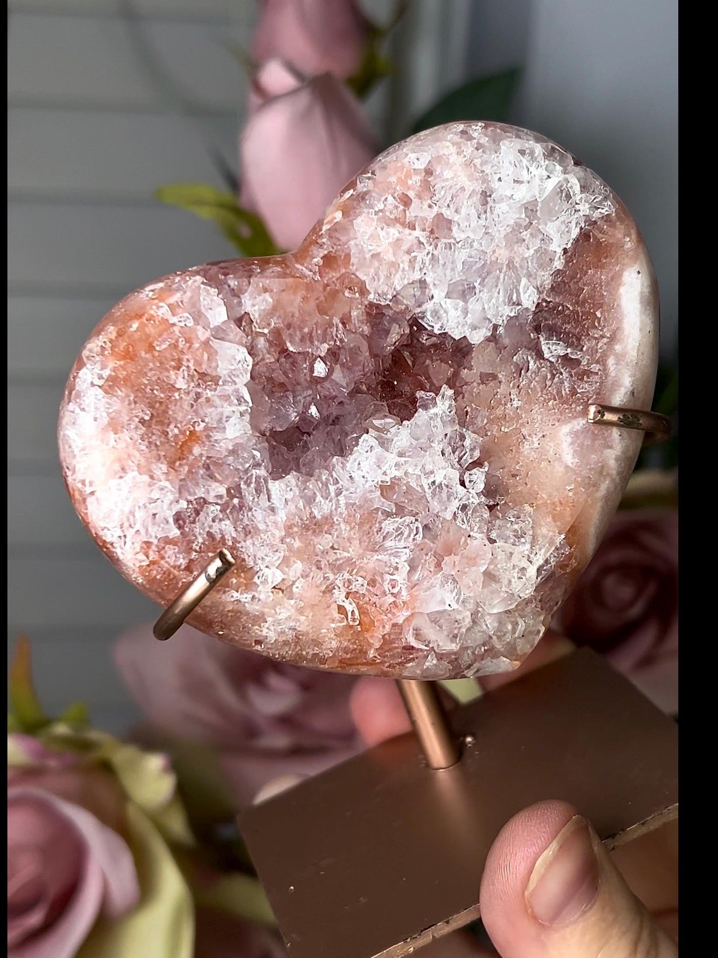 Beautiful, pink amethyst heart with vibrant red tone quartz, on stand