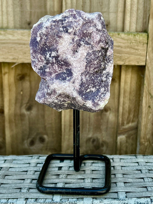 Rough lepidolite on stand