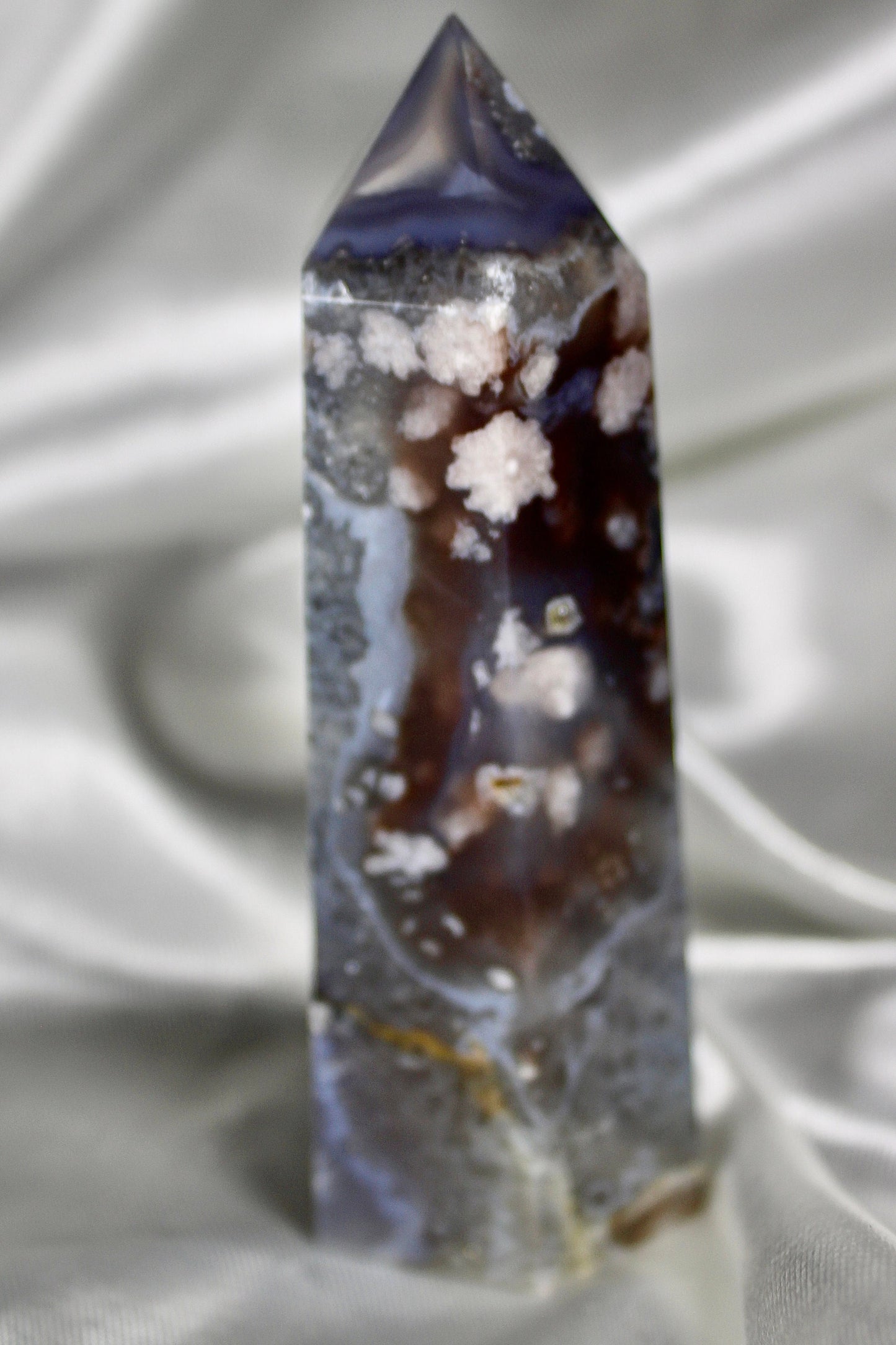 Black/grey/blue flower agate tower with banding and quartz 254g 11cm