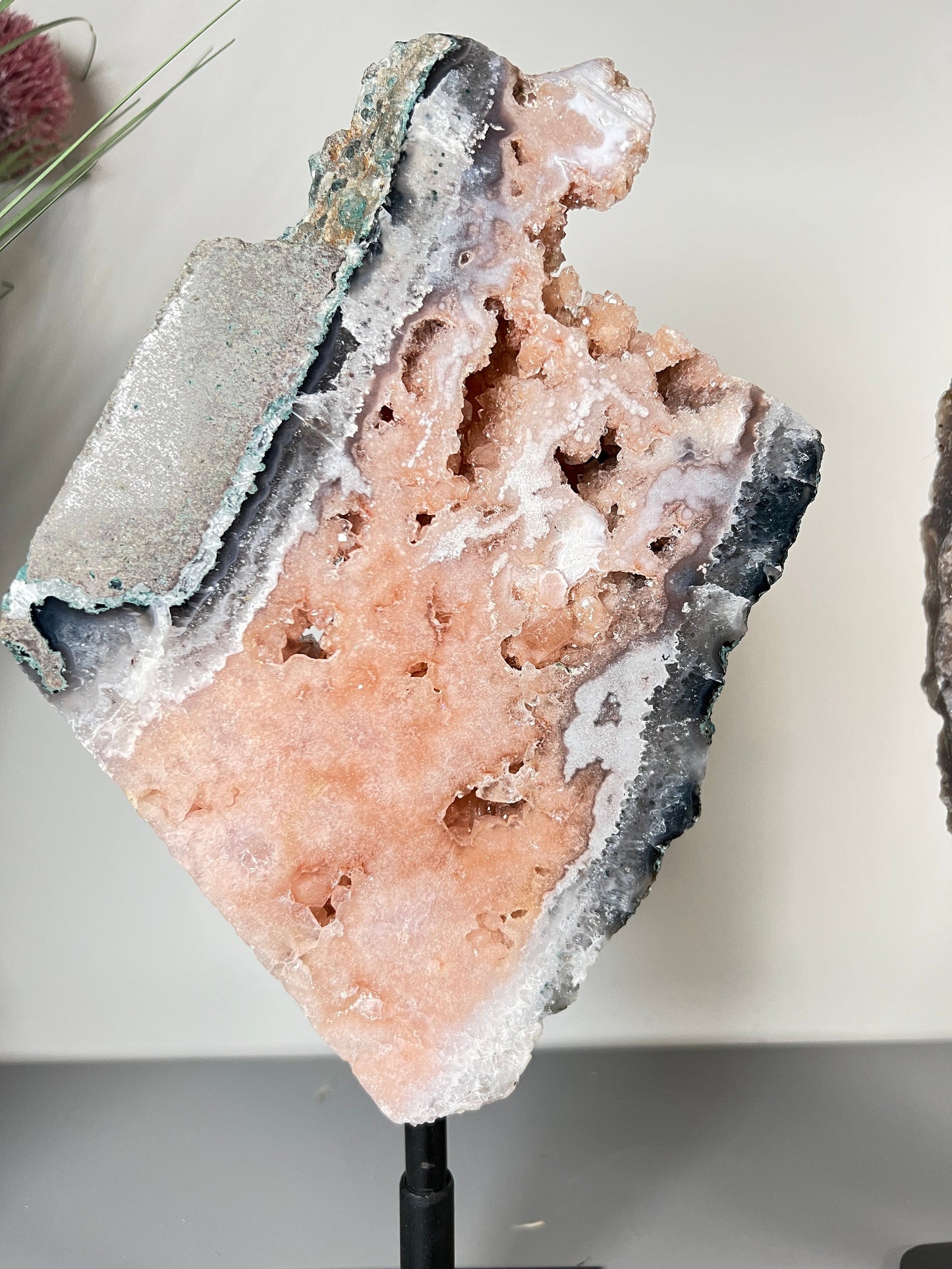 Gorgeous, peach, pink amethyst with smoky crystallisation and natural stone edging slab on turntable stand