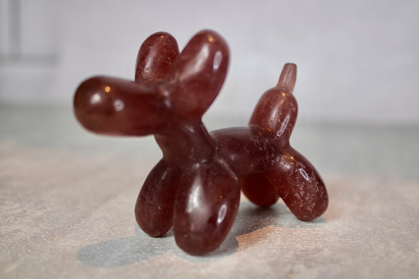 Strawberry quartz, balloon dog, carving 5.5(H) 7.5(L)