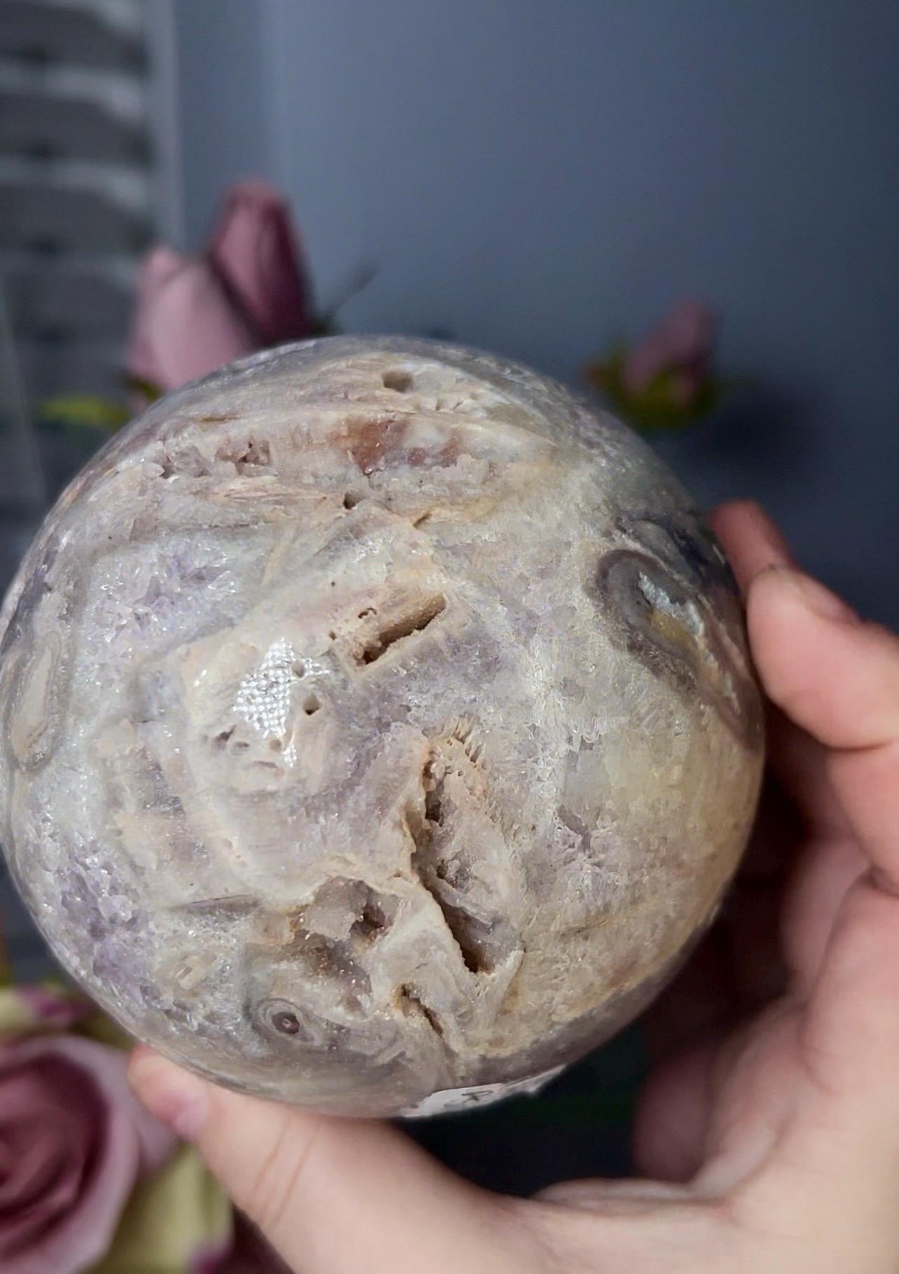 large, statement pink amethyst sphere with rutile formations and agate byover 1.220kg