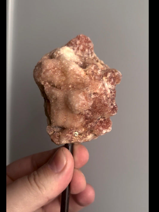 Red pink amethyst geode on stand