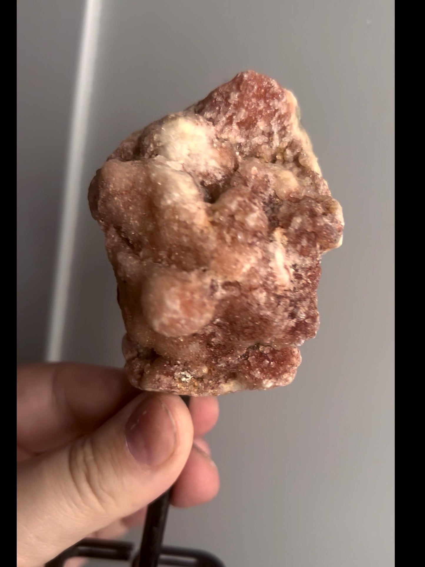 Red pink amethyst geode on stand