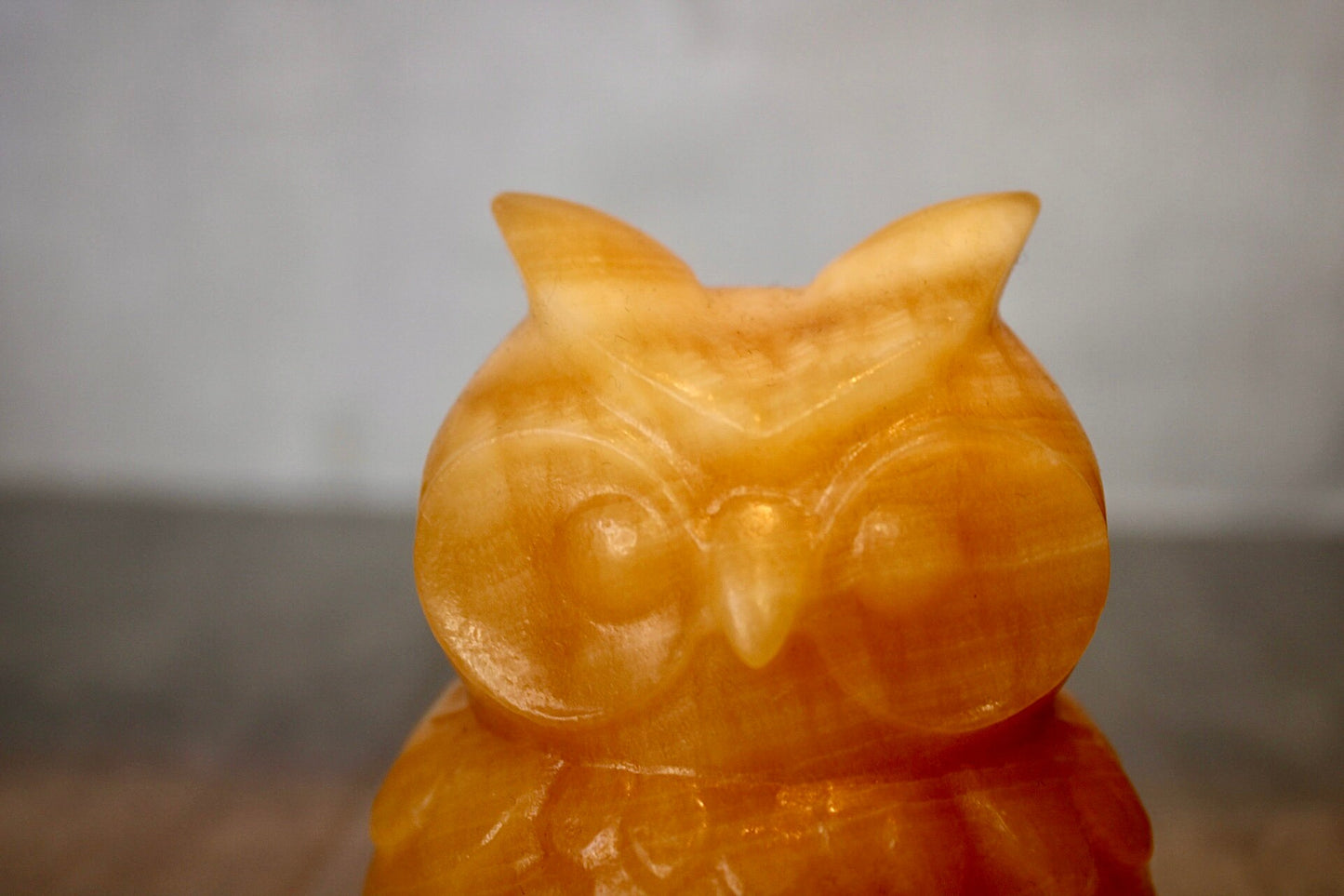 Large, orange calcite, owl carving 10cm(h) 8cm(w)