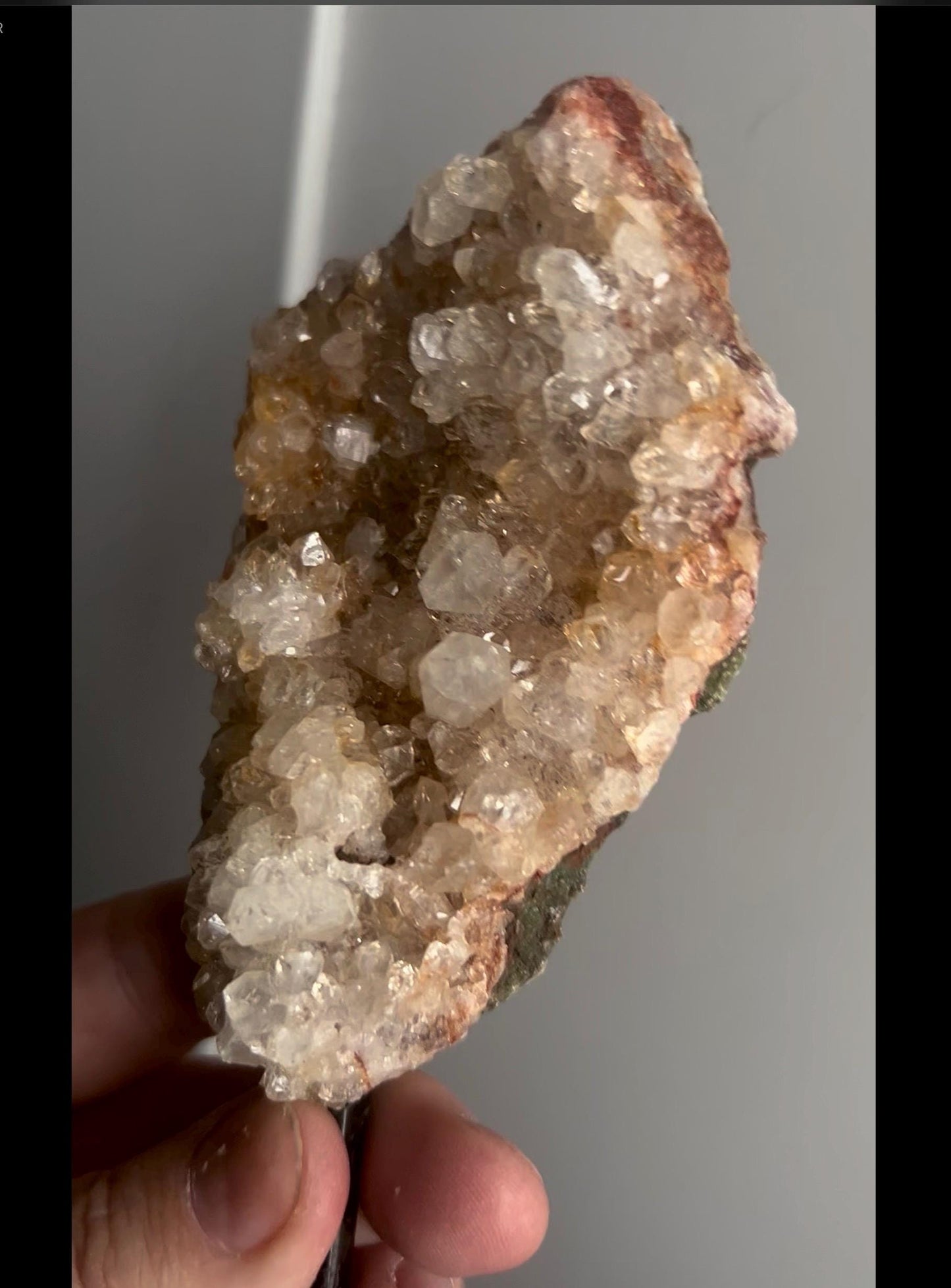 High grade, pink amethyst geode on stand with high clarity quartz teeth