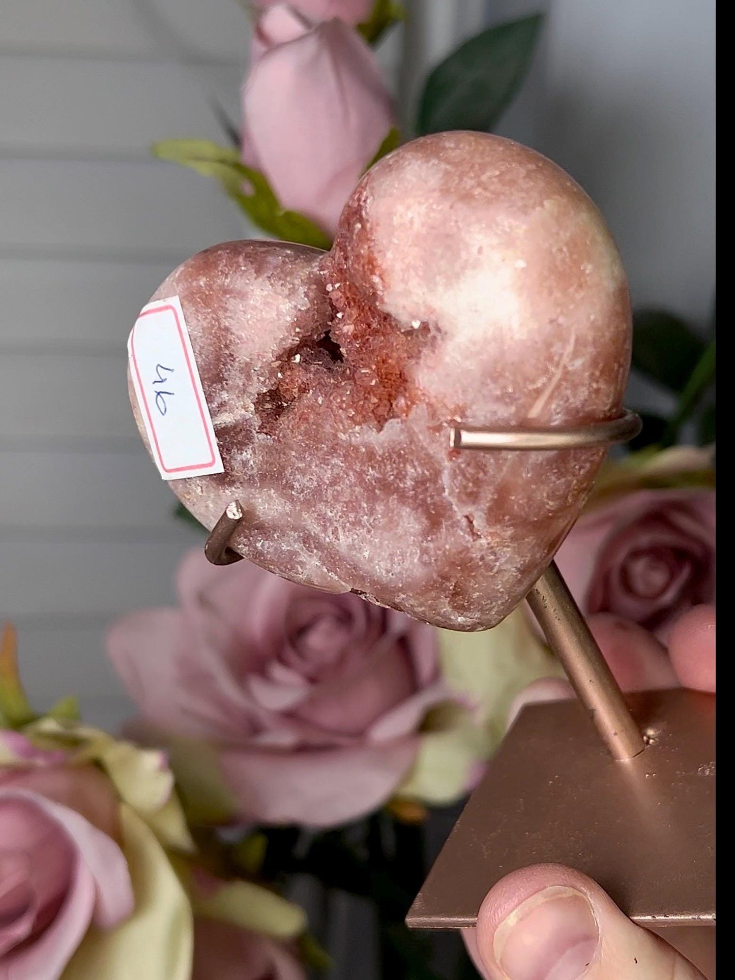 Beautiful, pink amethyst heart in a red tone with stand