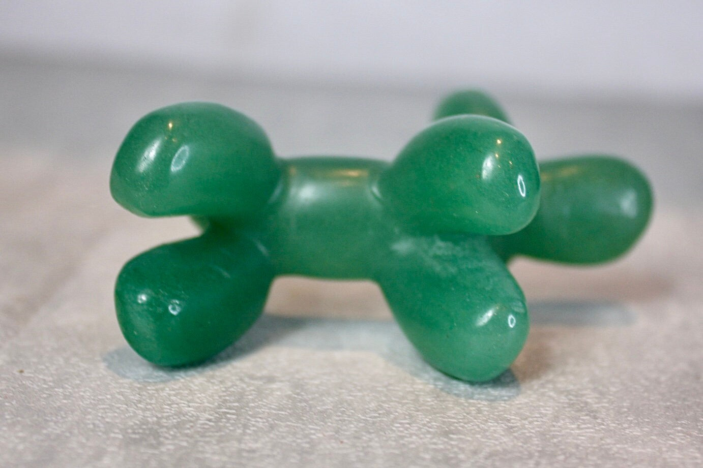 Green, strawberry quartz, balloon dog, carving 5.5 (h) 8cm (L)