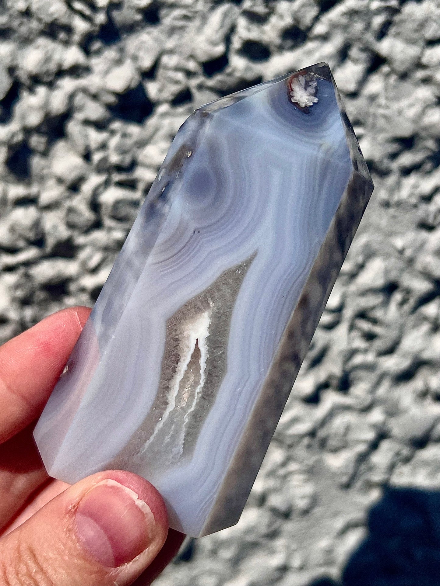 Black/grey/blue flower agate tower with banding and quartz 254g 11cm