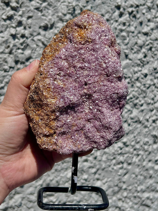 Rough lepidolite on stand