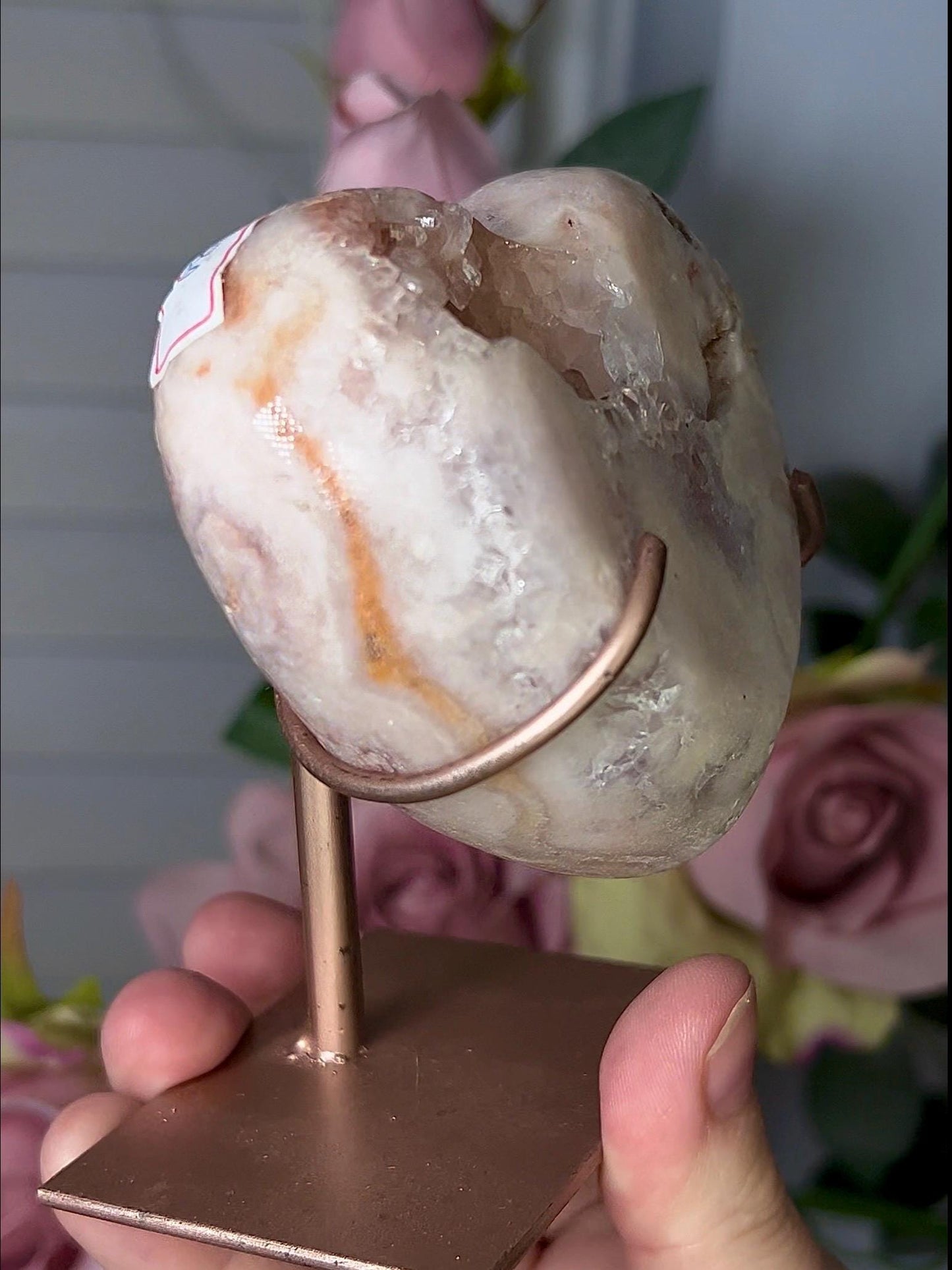Beautiful, pink amethyst heart in peach tones with stand