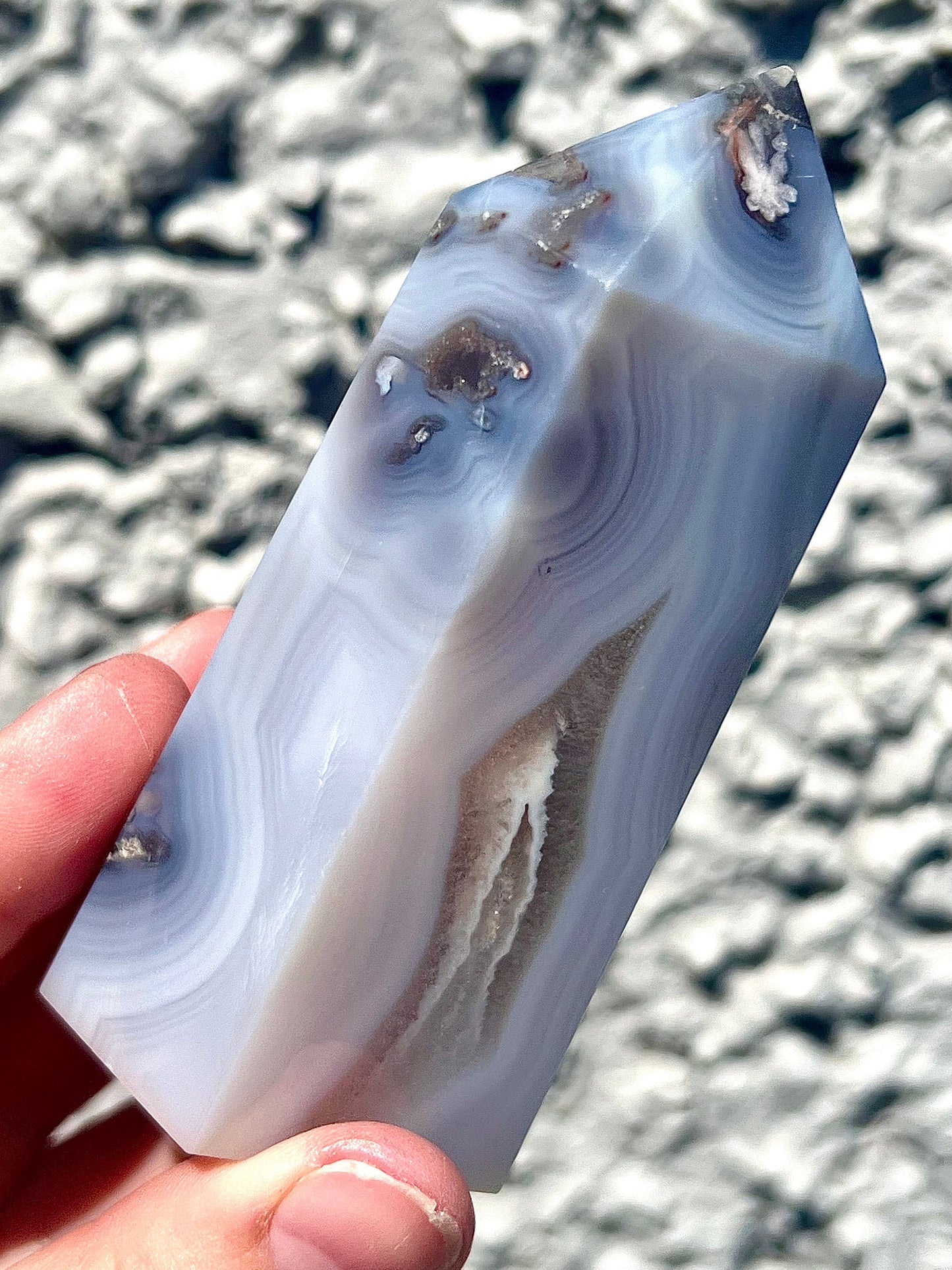 Black/grey/blue flower agate tower with banding and quartz 254g 11cm