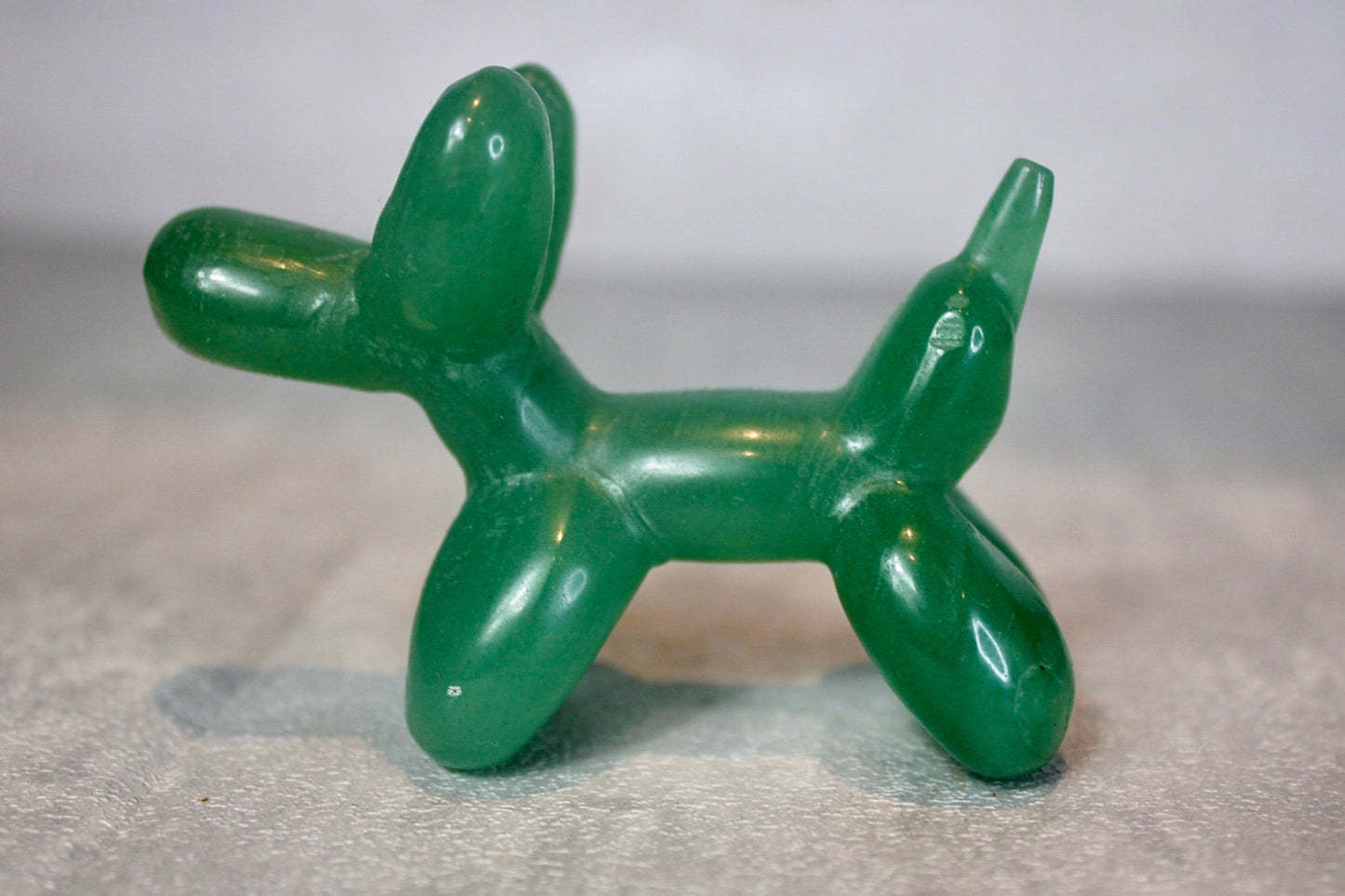 Green, strawberry quartz, balloon dog, carving 5.5 (h) 8cm (L)