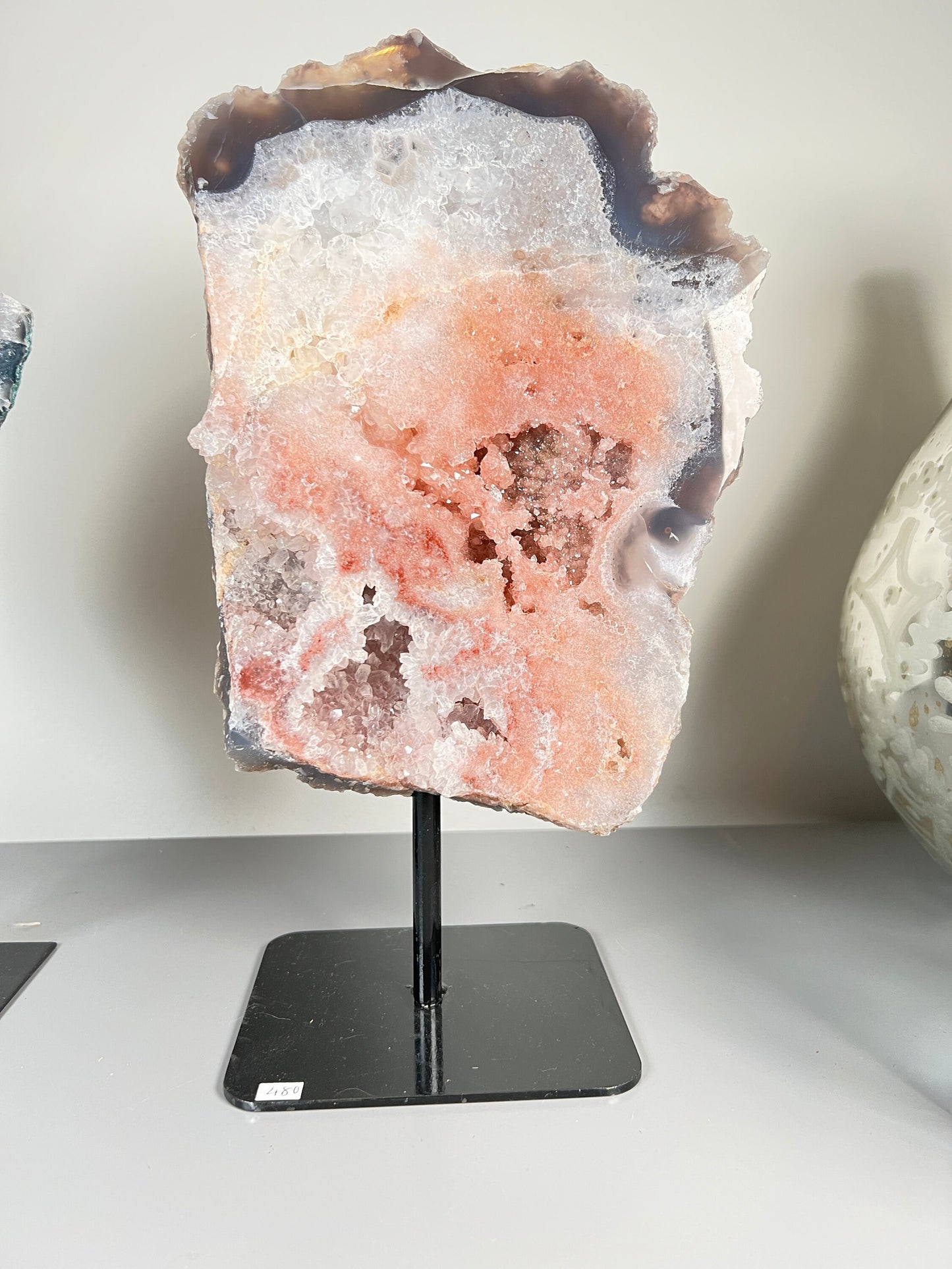 Peach, pink amethyst slab on stand  with smoky, clear and red crystallisation