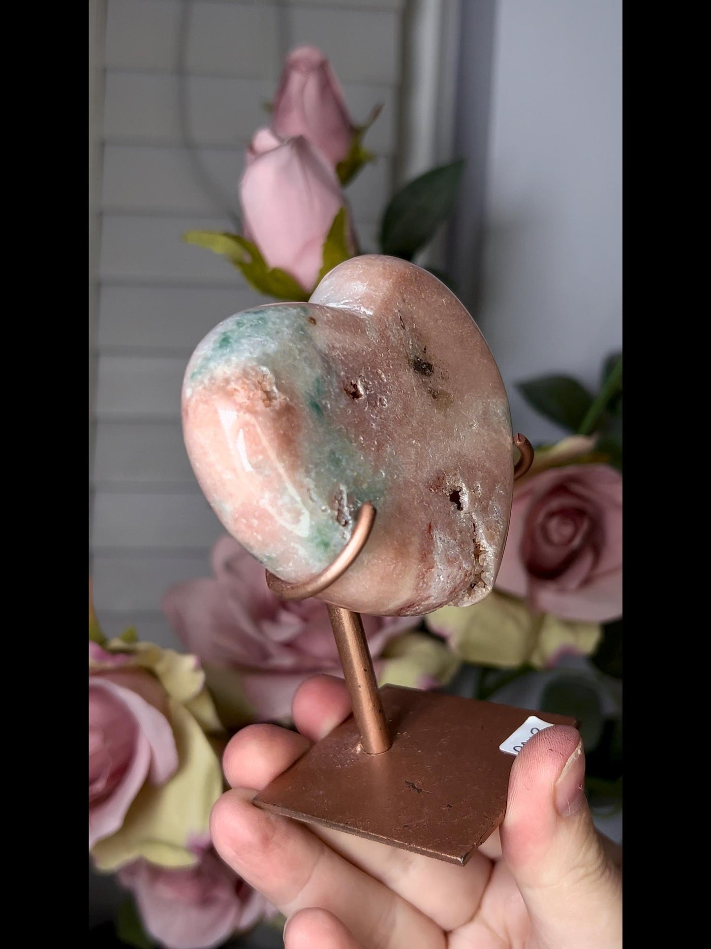 Beautiful, pink amethyst heart in peach tones with stand which has some scratches (discount added)