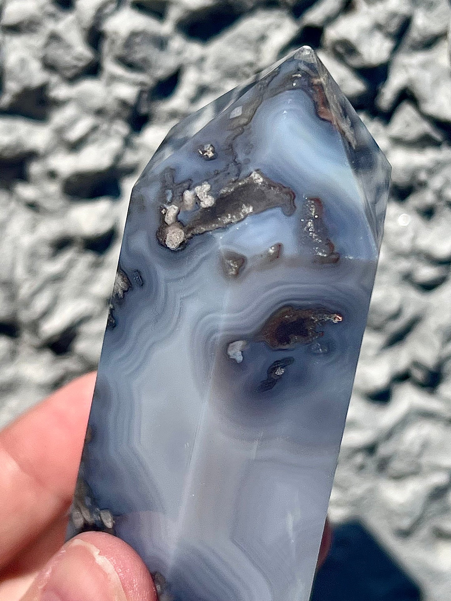 Black/grey/blue flower agate tower with banding and quartz 254g 11cm