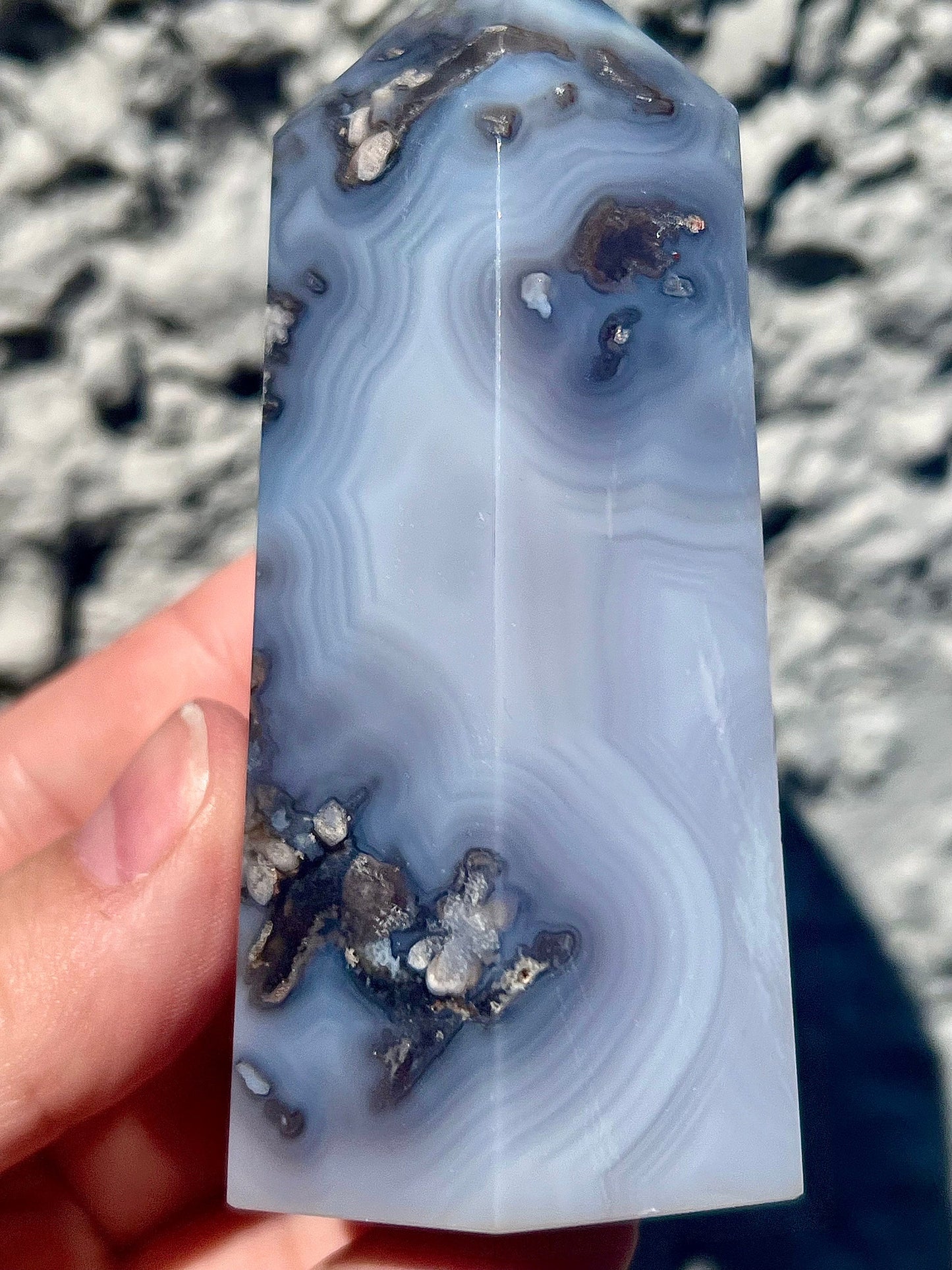 Black/grey/blue flower agate tower with banding and quartz 254g 11cm