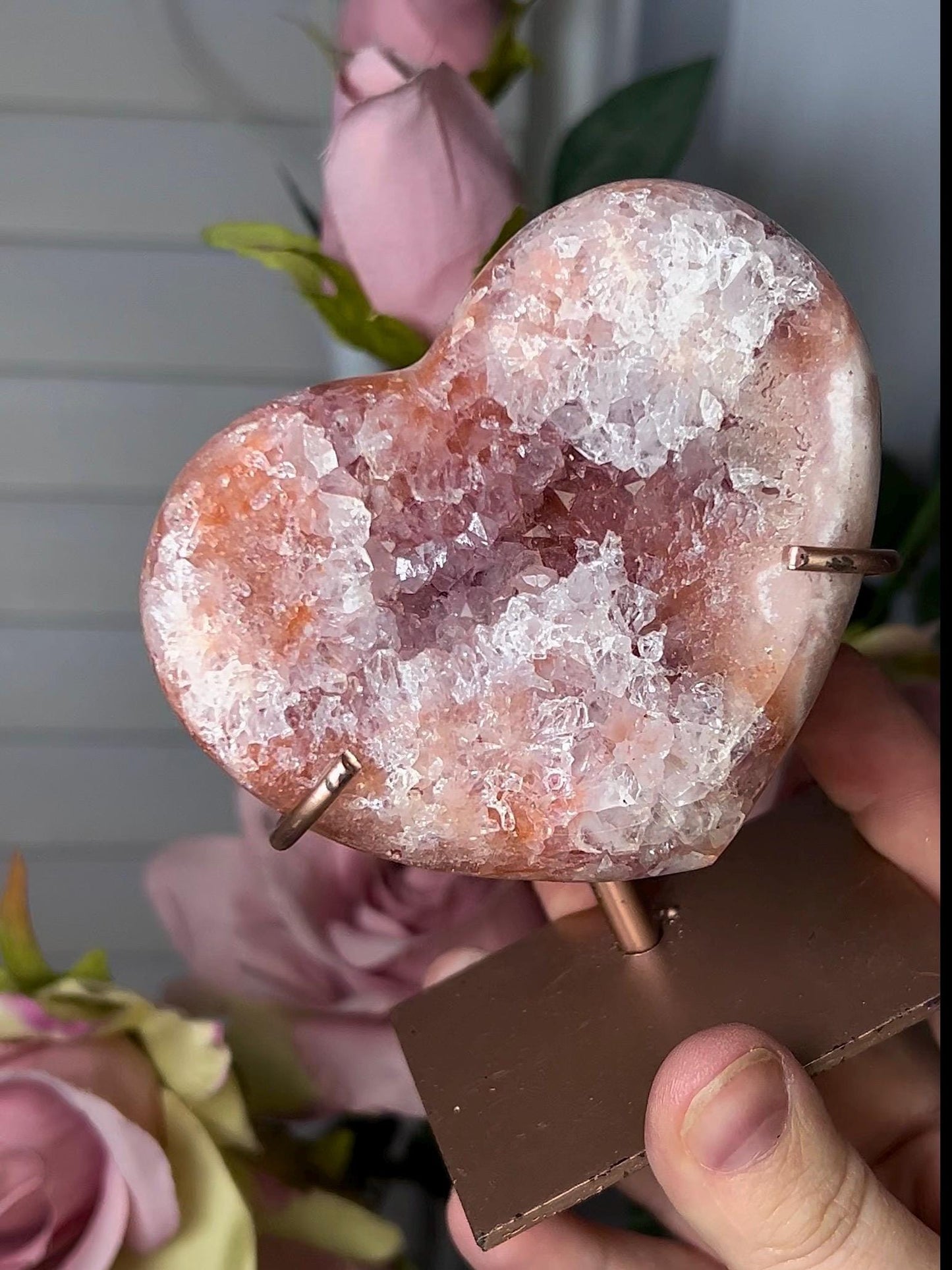 Beautiful, pink amethyst heart with vibrant red tone quartz, on stand