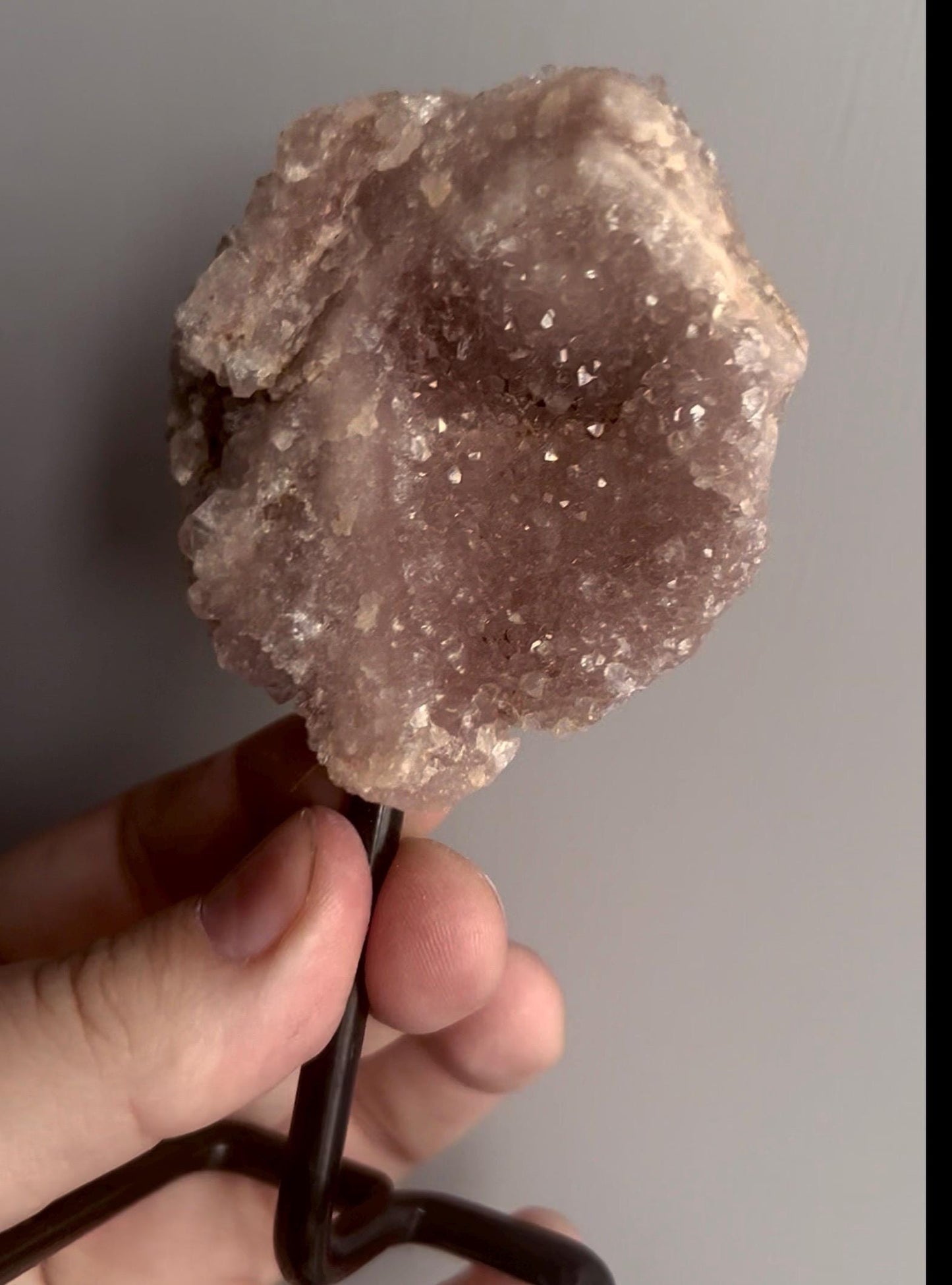 pink amethyst geode on stand