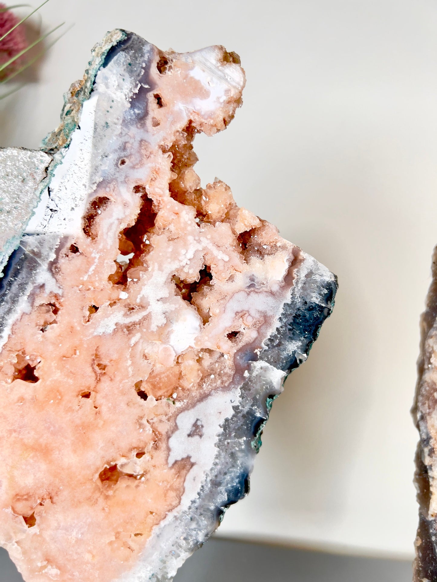 Gorgeous, peach, pink amethyst with smoky crystallisation and natural stone edging slab on turntable stand