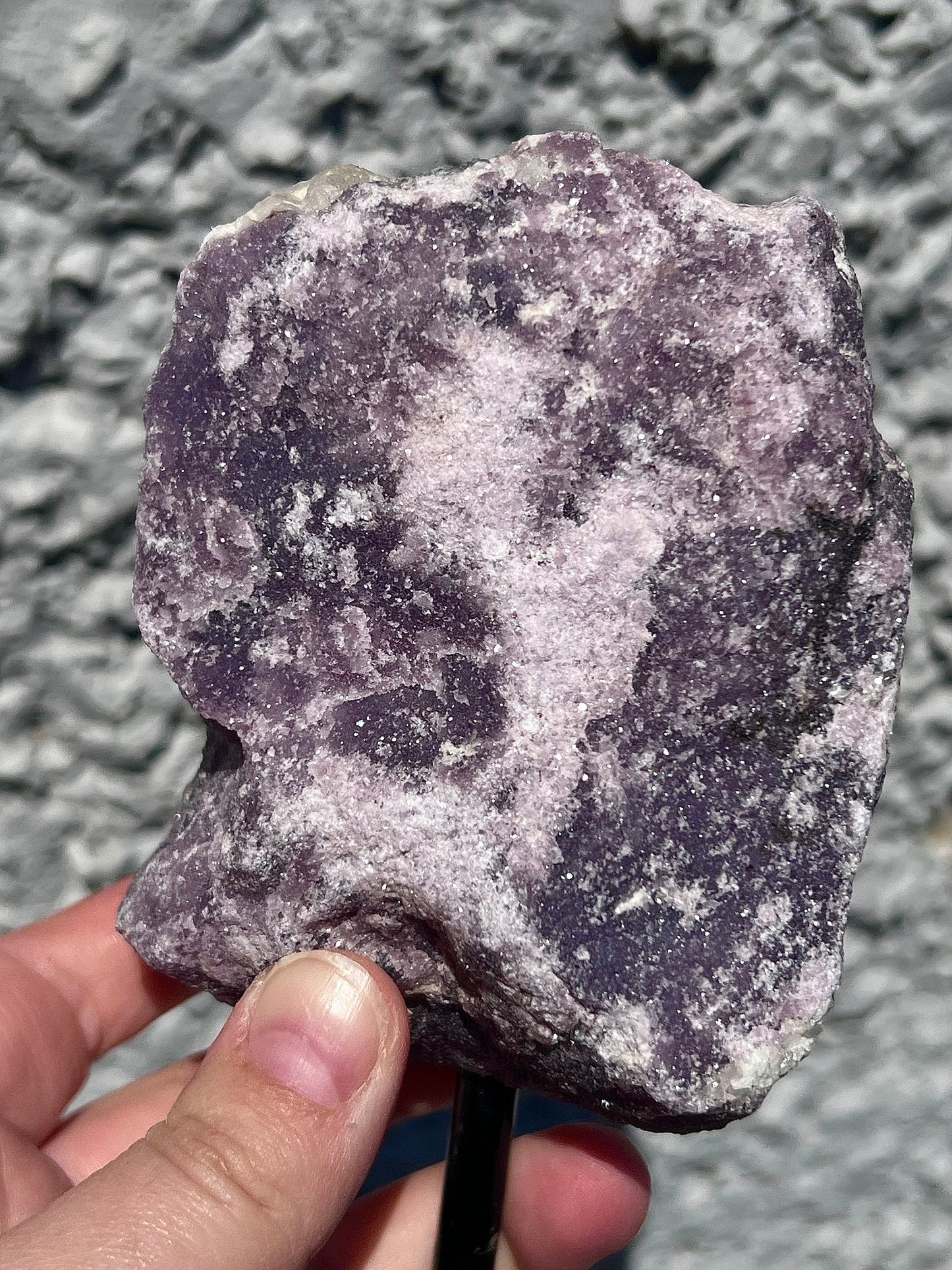 Rough lepidolite on stand
