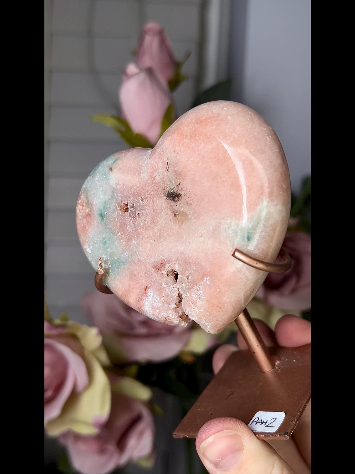 Beautiful, pink amethyst heart in peach tones with stand which has some scratches (discount added)