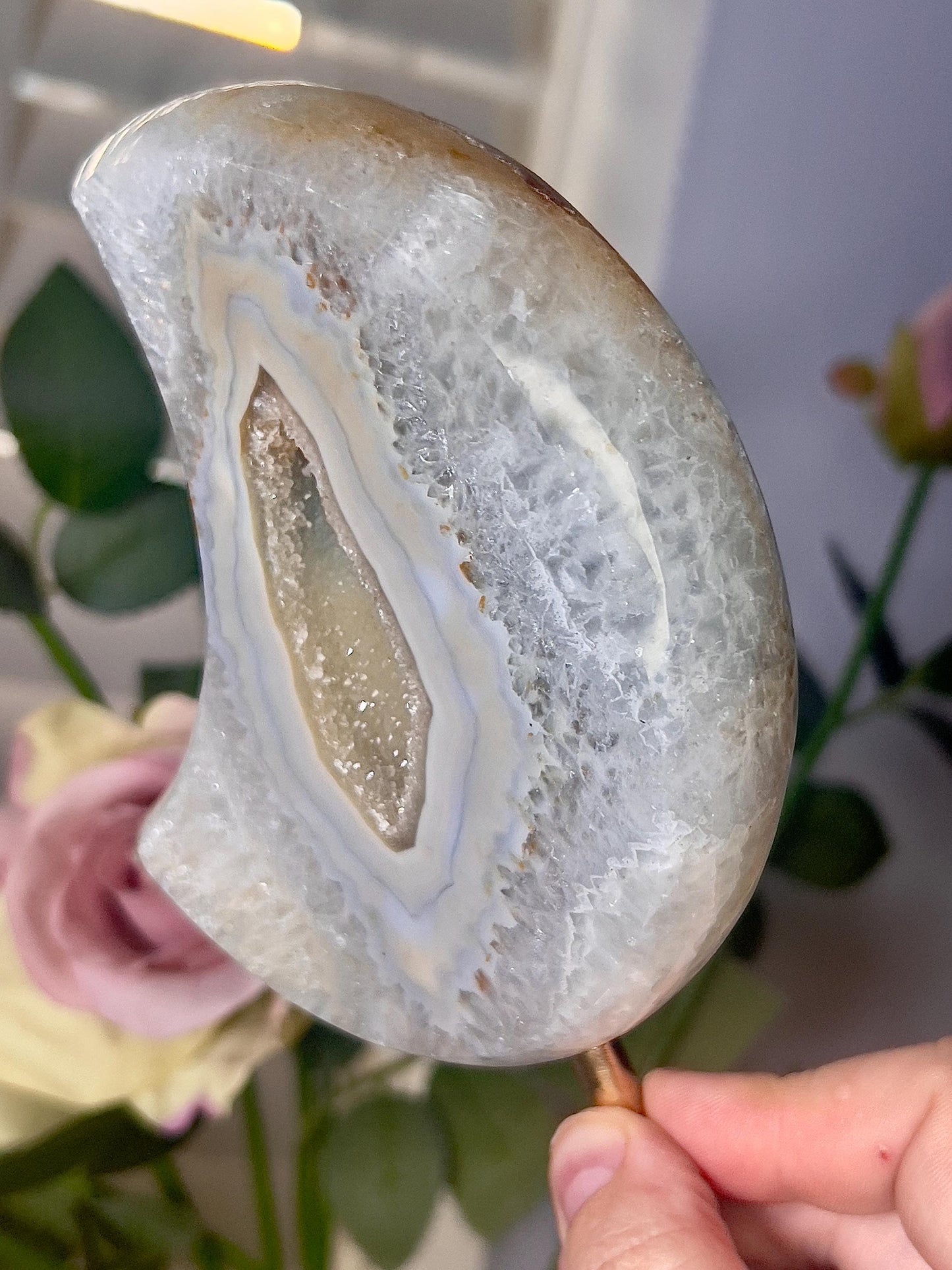 Beautiful, agate moon, with lime green toned, open druzy middle, on stand 640g 19cmt(h)