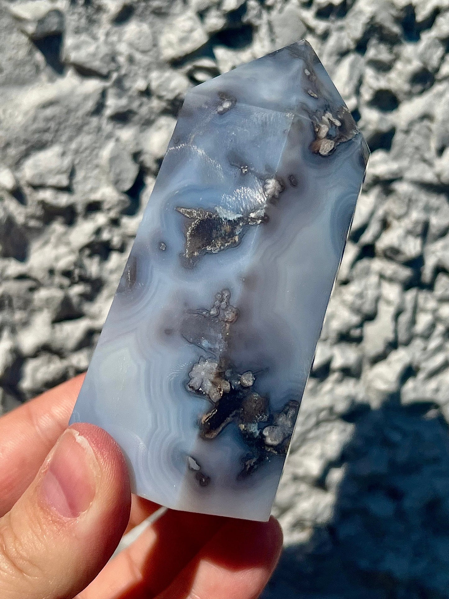 Black/grey/blue flower agate tower with banding and quartz 254g 11cm