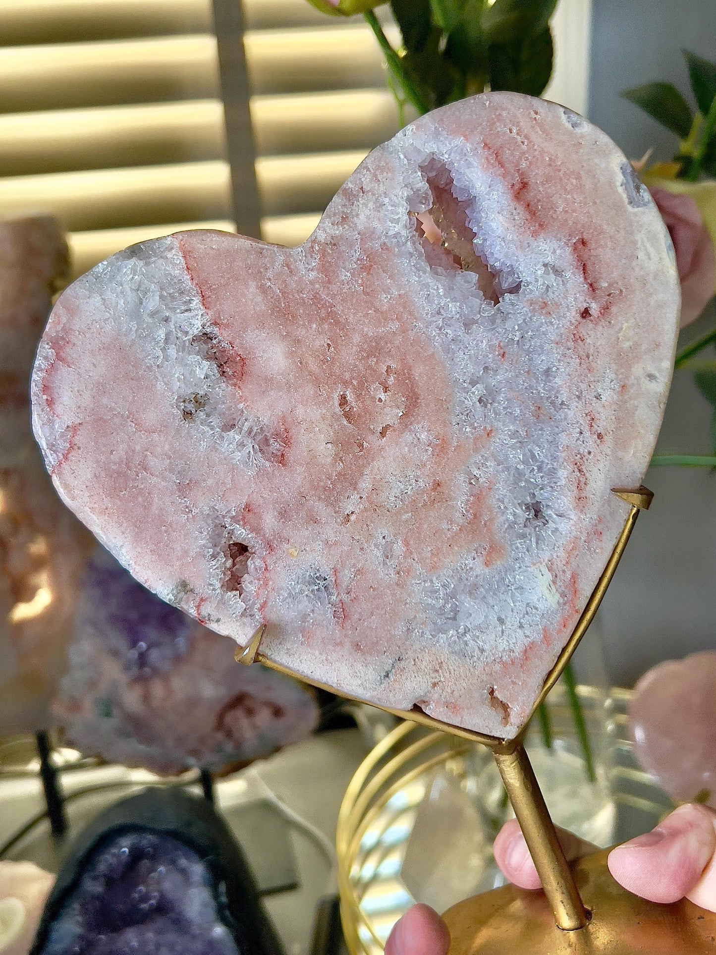 High quality, peach toned, pink amethyst heart with high drape quartz & red hematite lining on a custom gold stand 1.274kg