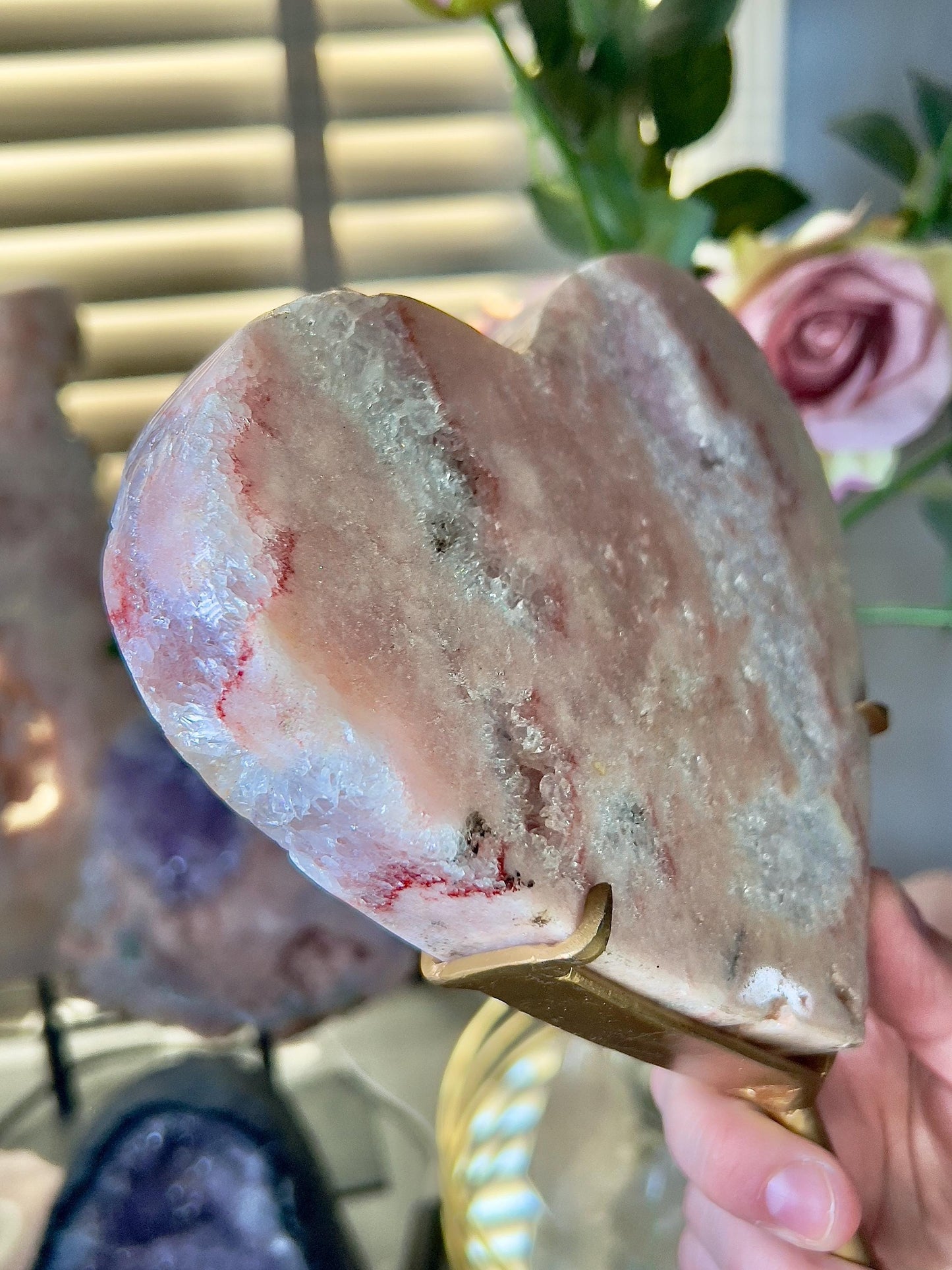 High quality, peach toned, pink amethyst heart with high drape quartz & red hematite lining on a custom gold stand 1.274kg