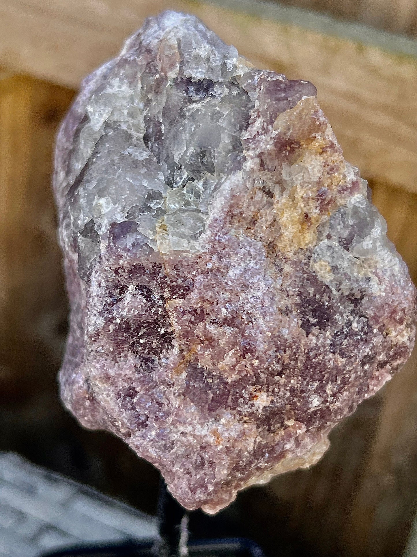 Rough lepidolite on stand