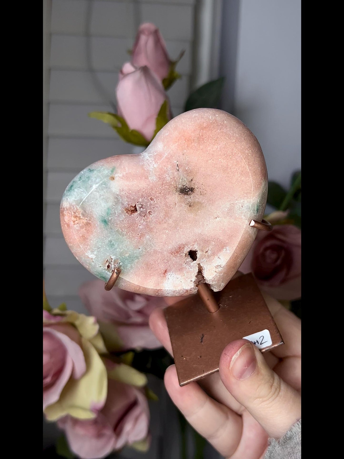 Beautiful, pink amethyst heart in peach tones with stand which has some scratches (discount added)